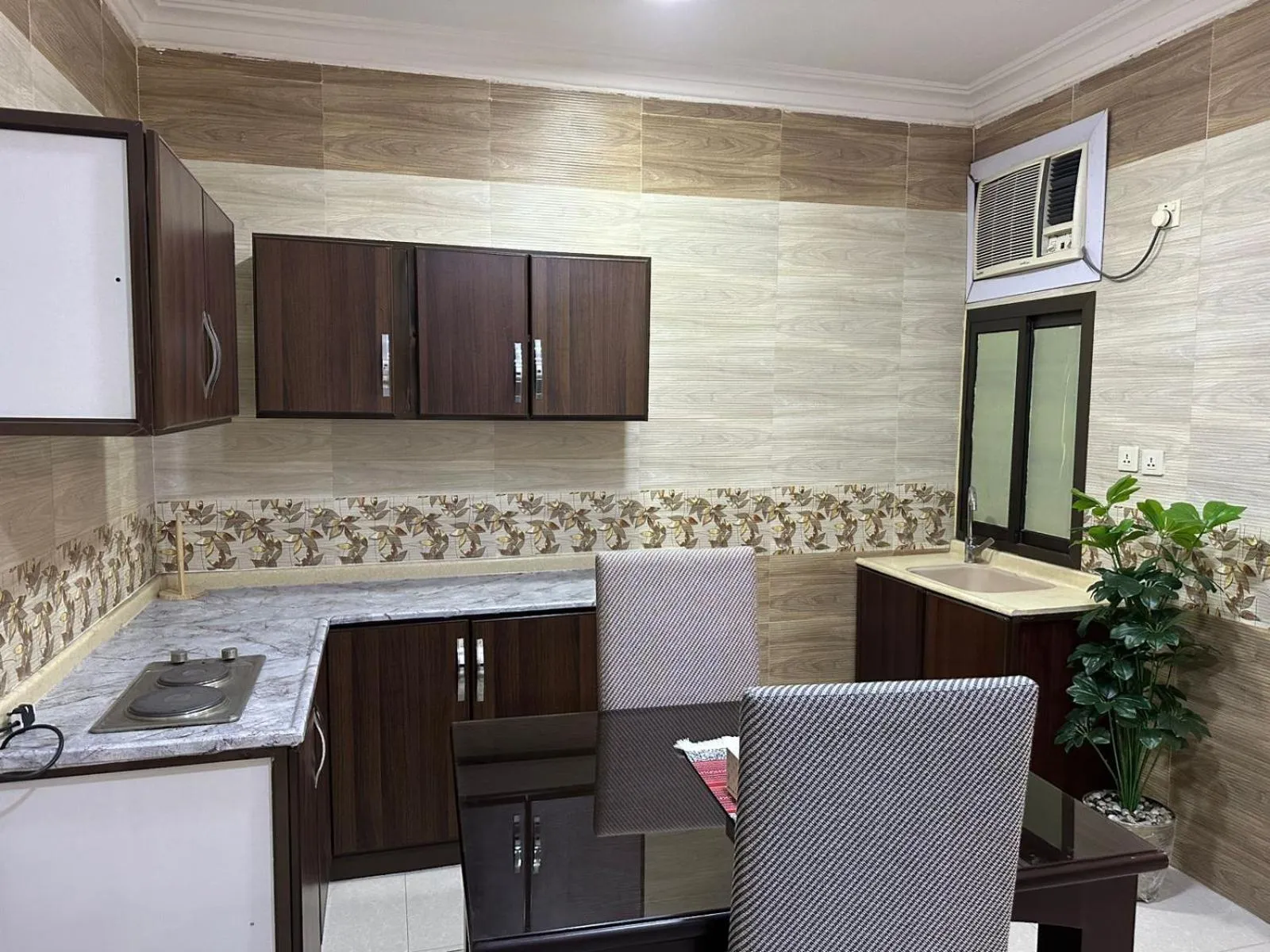 Kitchen or kitchenette in Al Massah Al Khalijiyah Furnished Units