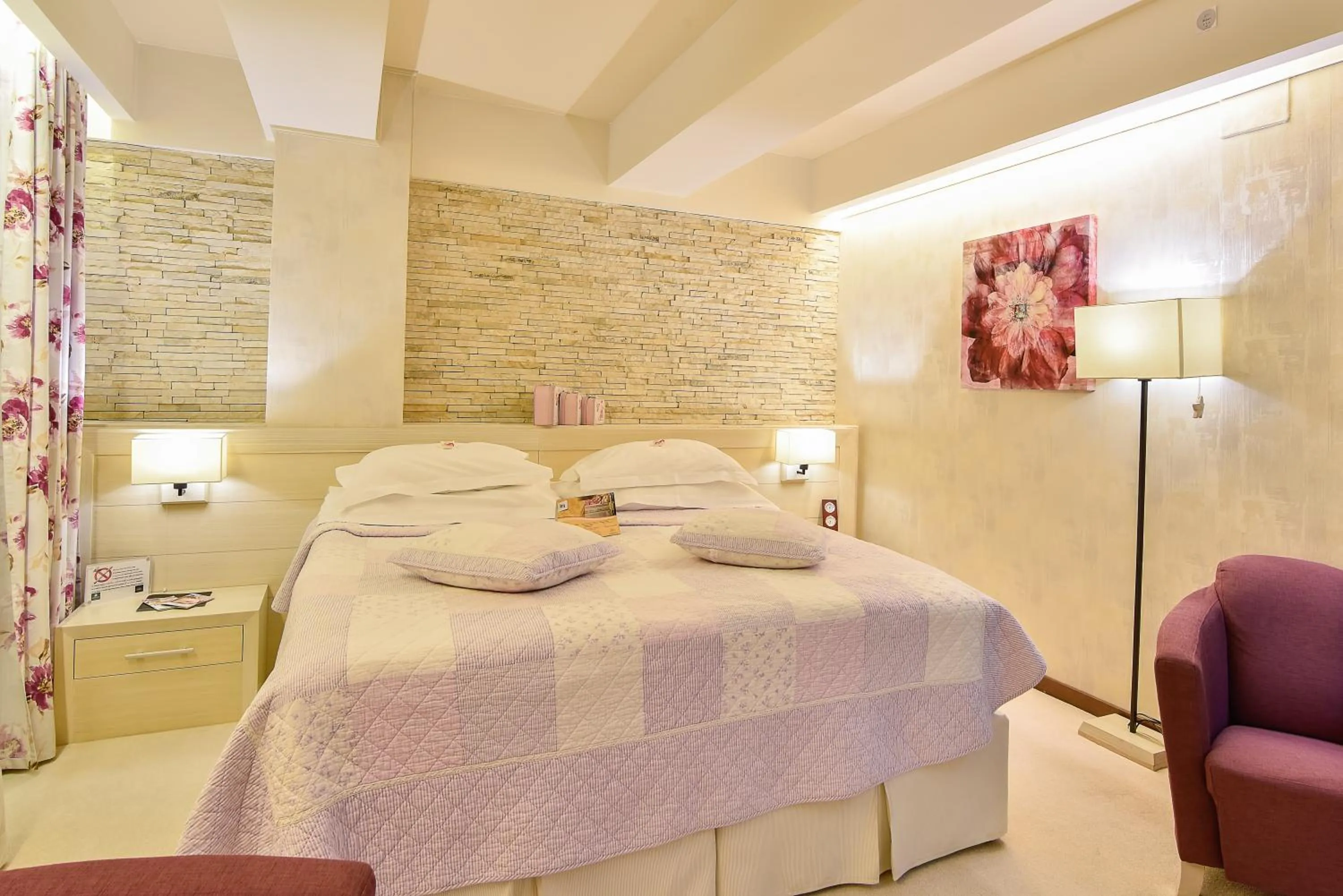 Bed in Ioana Boutique Hotel