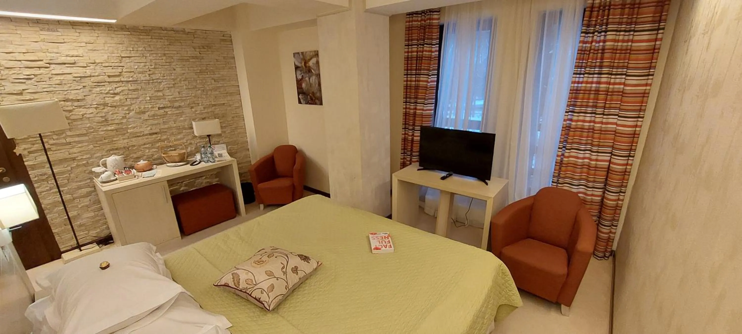 Bed in Ioana Boutique Hotel