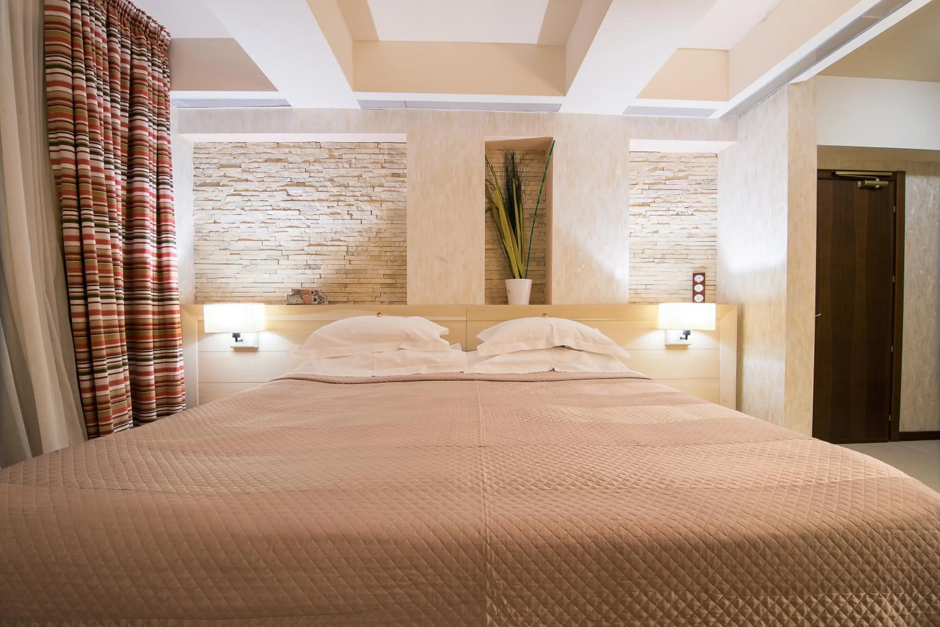 Bed in Ioana Boutique Hotel