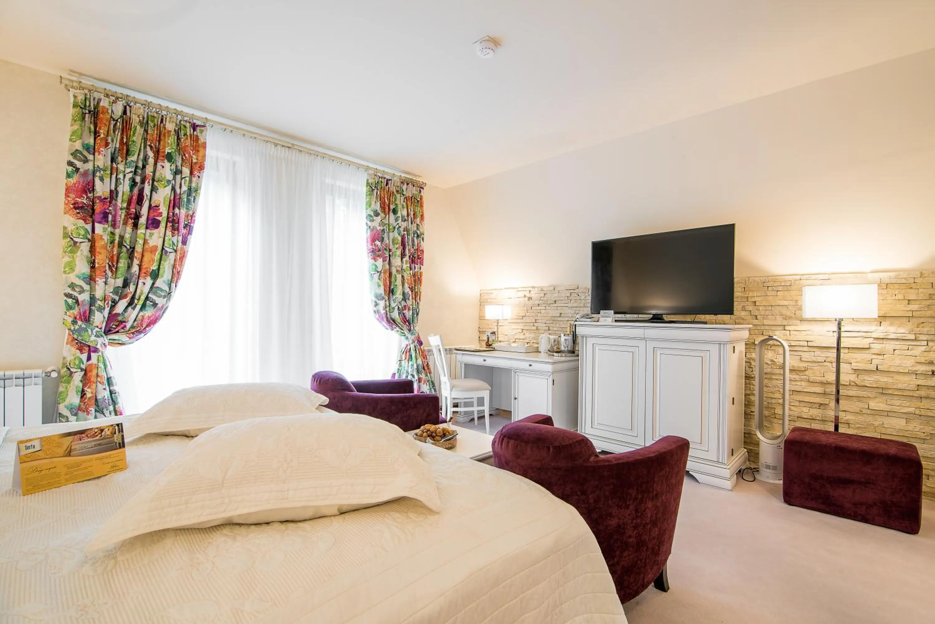 Bed in Ioana Boutique Hotel