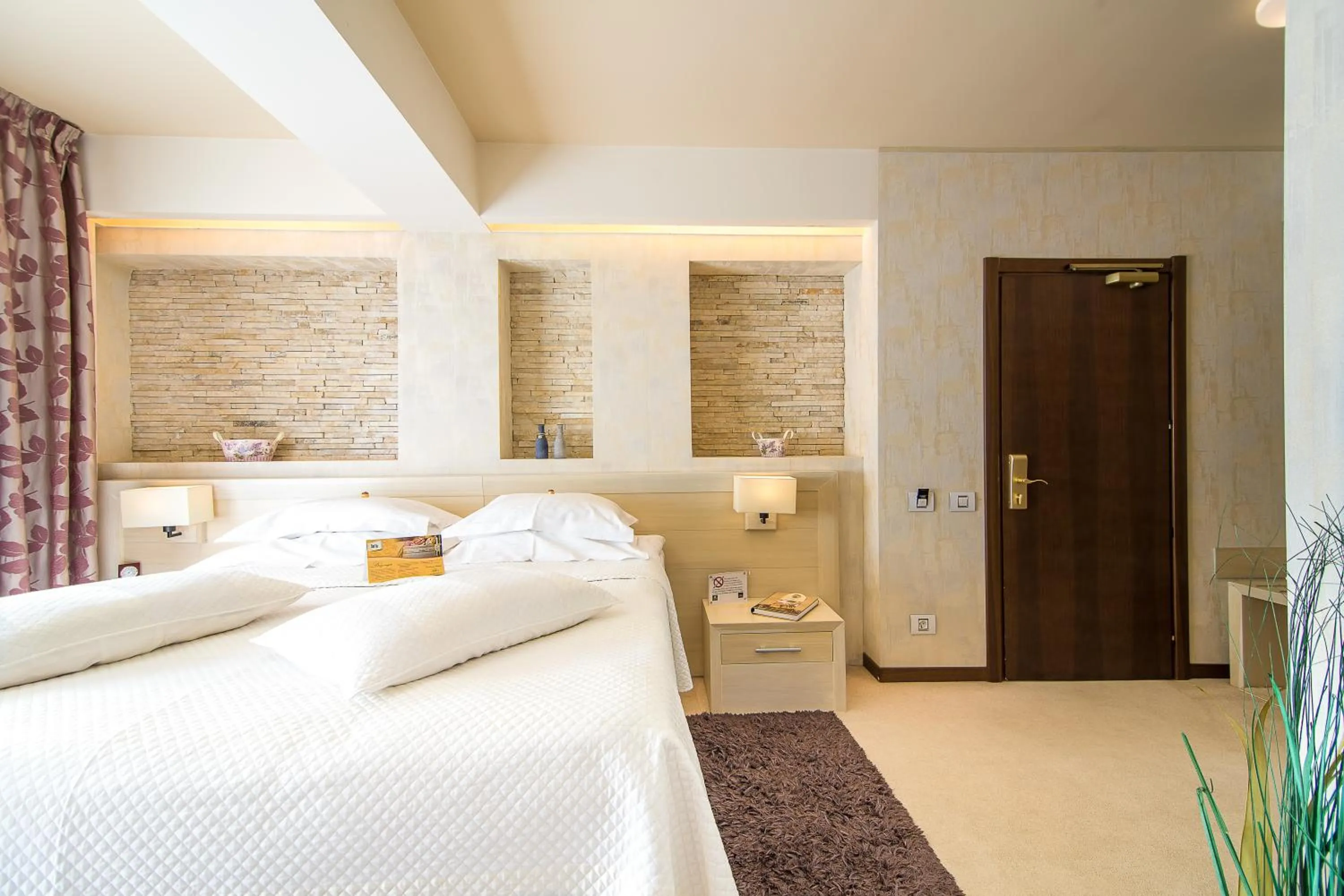 Bed in Ioana Boutique Hotel