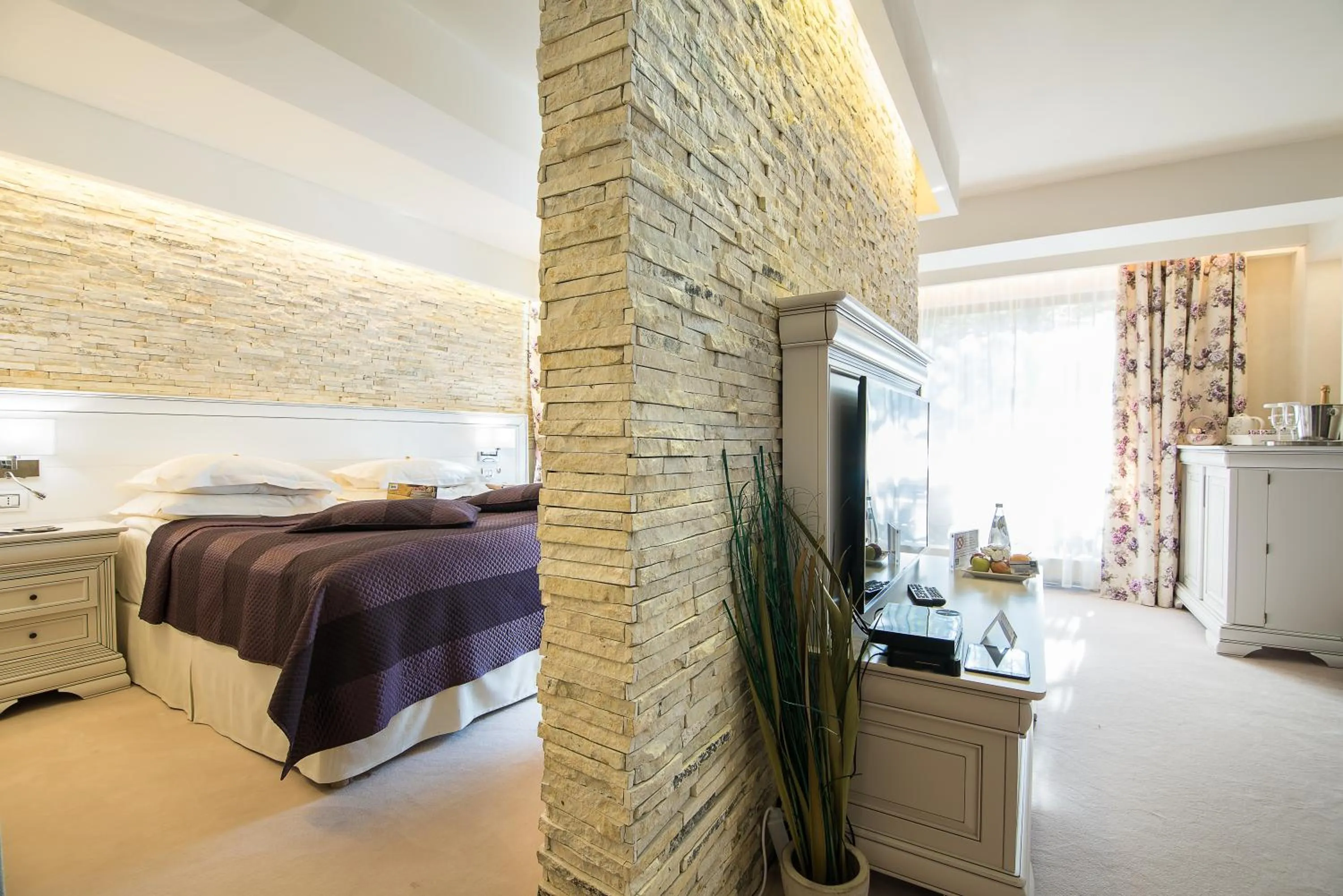 Bed in Ioana Boutique Hotel