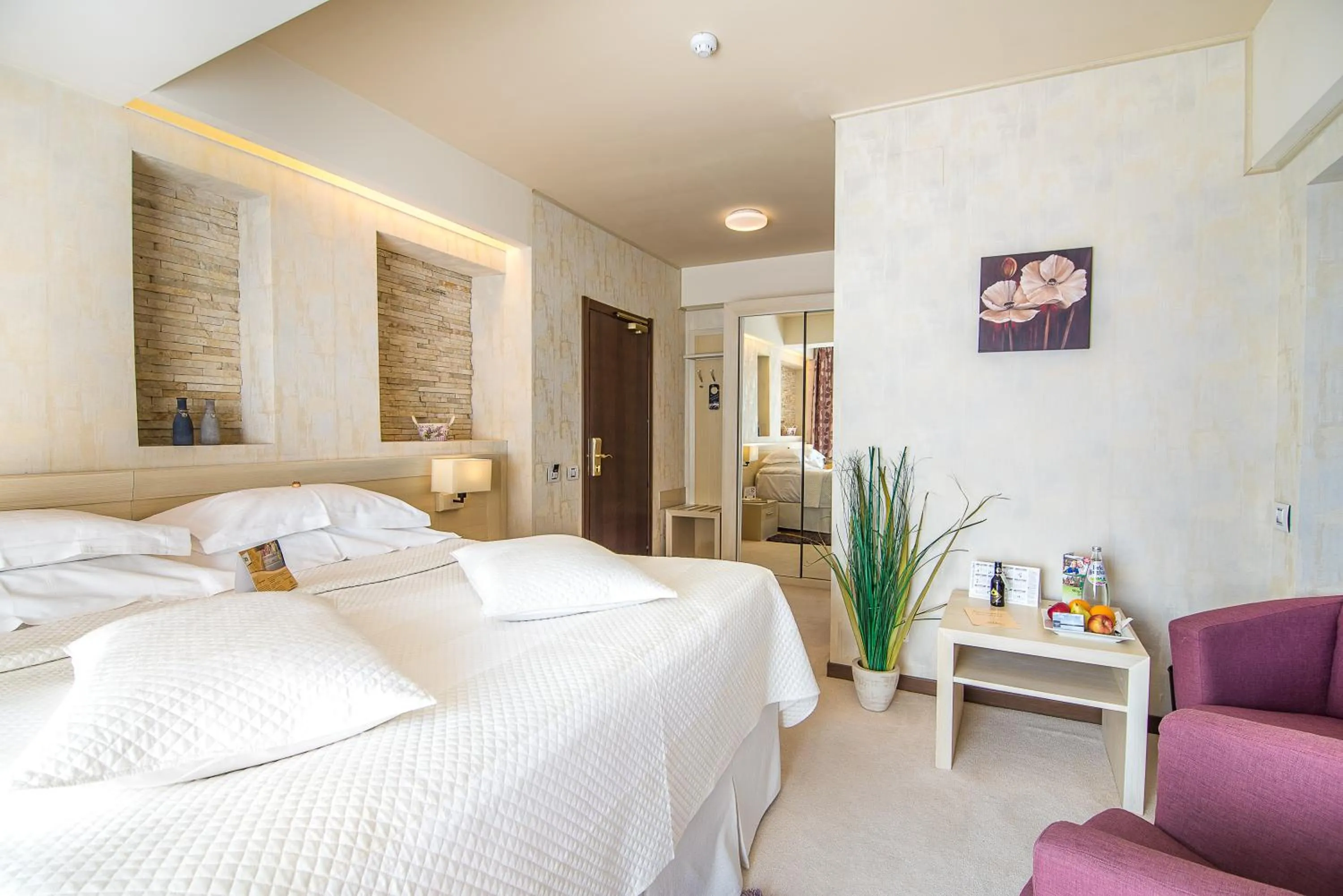 Bed in Ioana Boutique Hotel