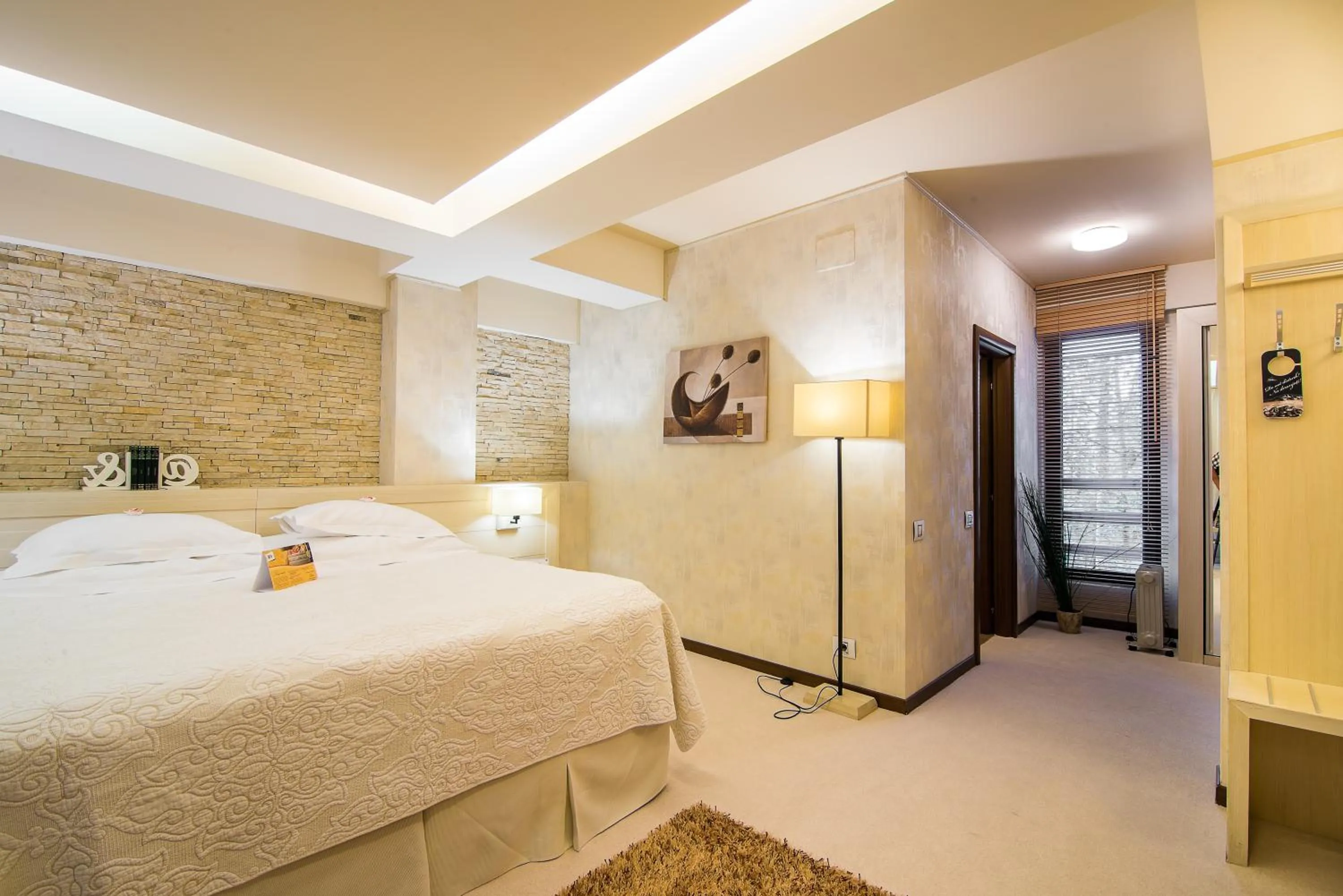 Bed in Ioana Boutique Hotel