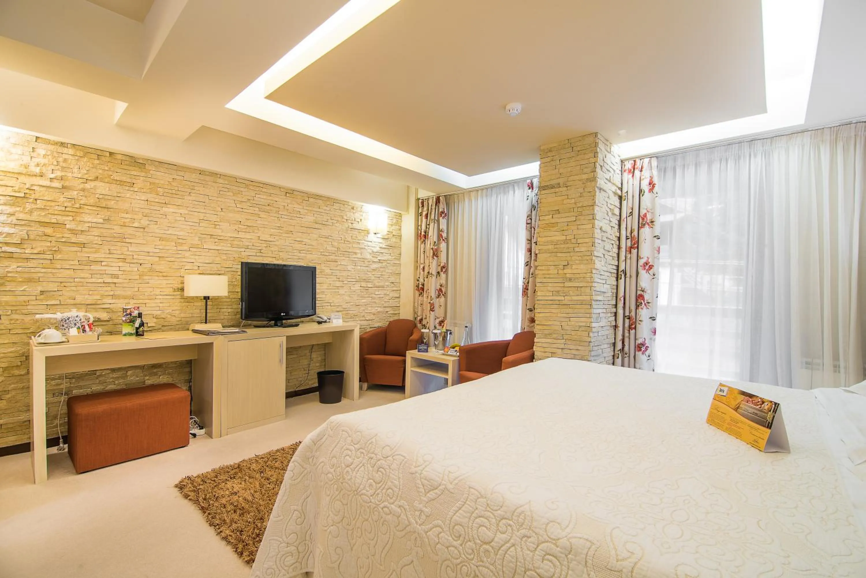 Bed in Ioana Boutique Hotel