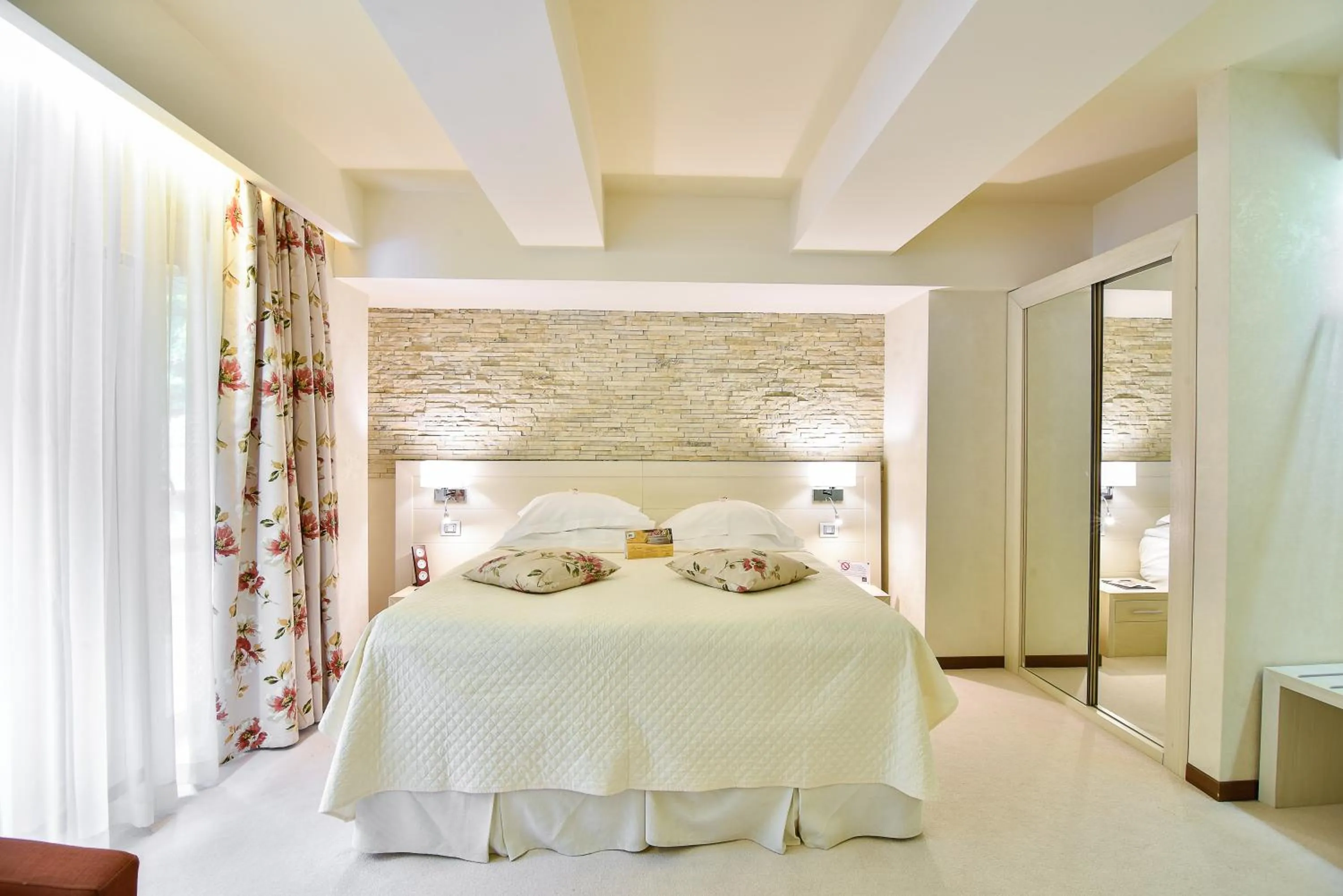 Bed in Ioana Boutique Hotel