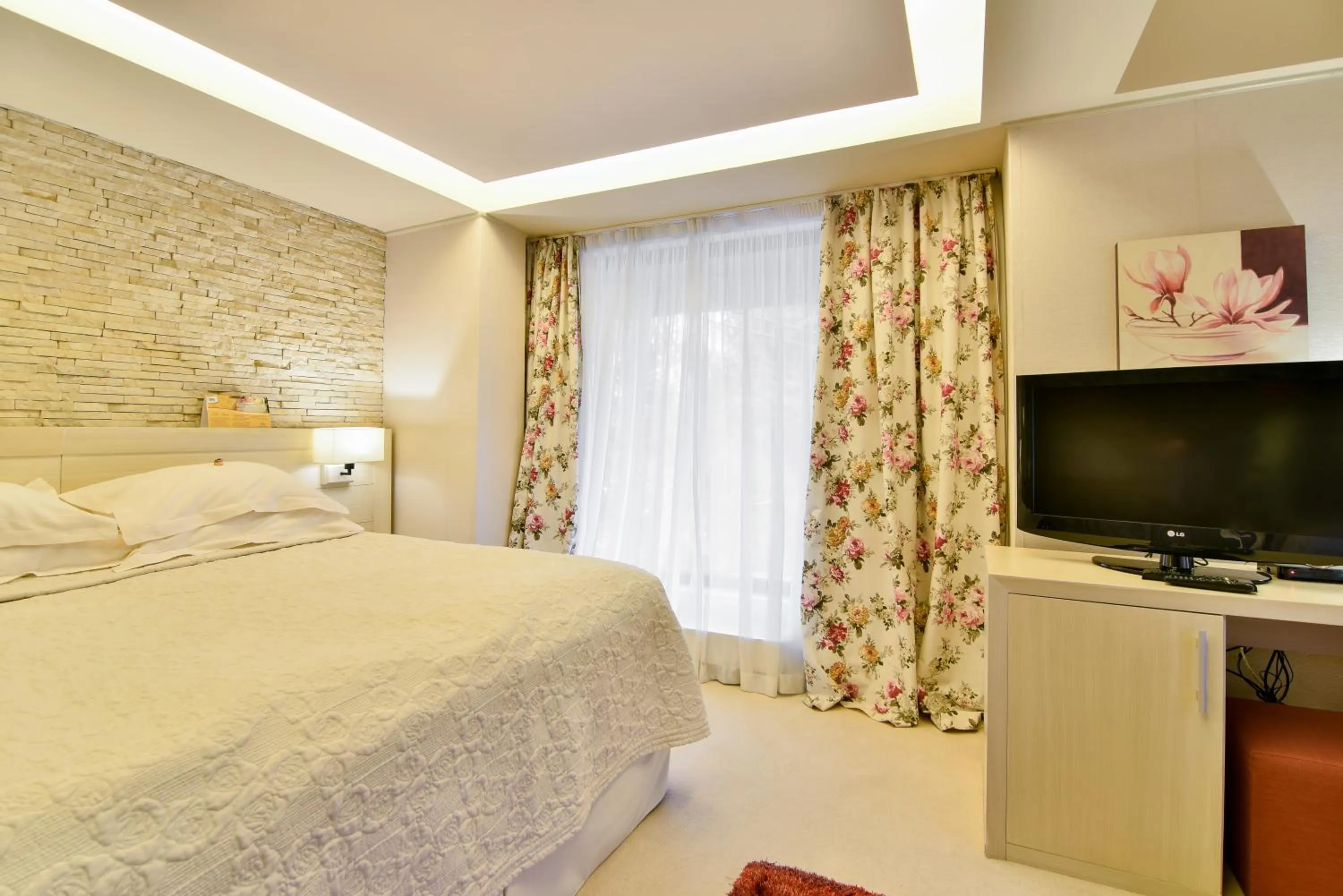 Bed in Ioana Boutique Hotel