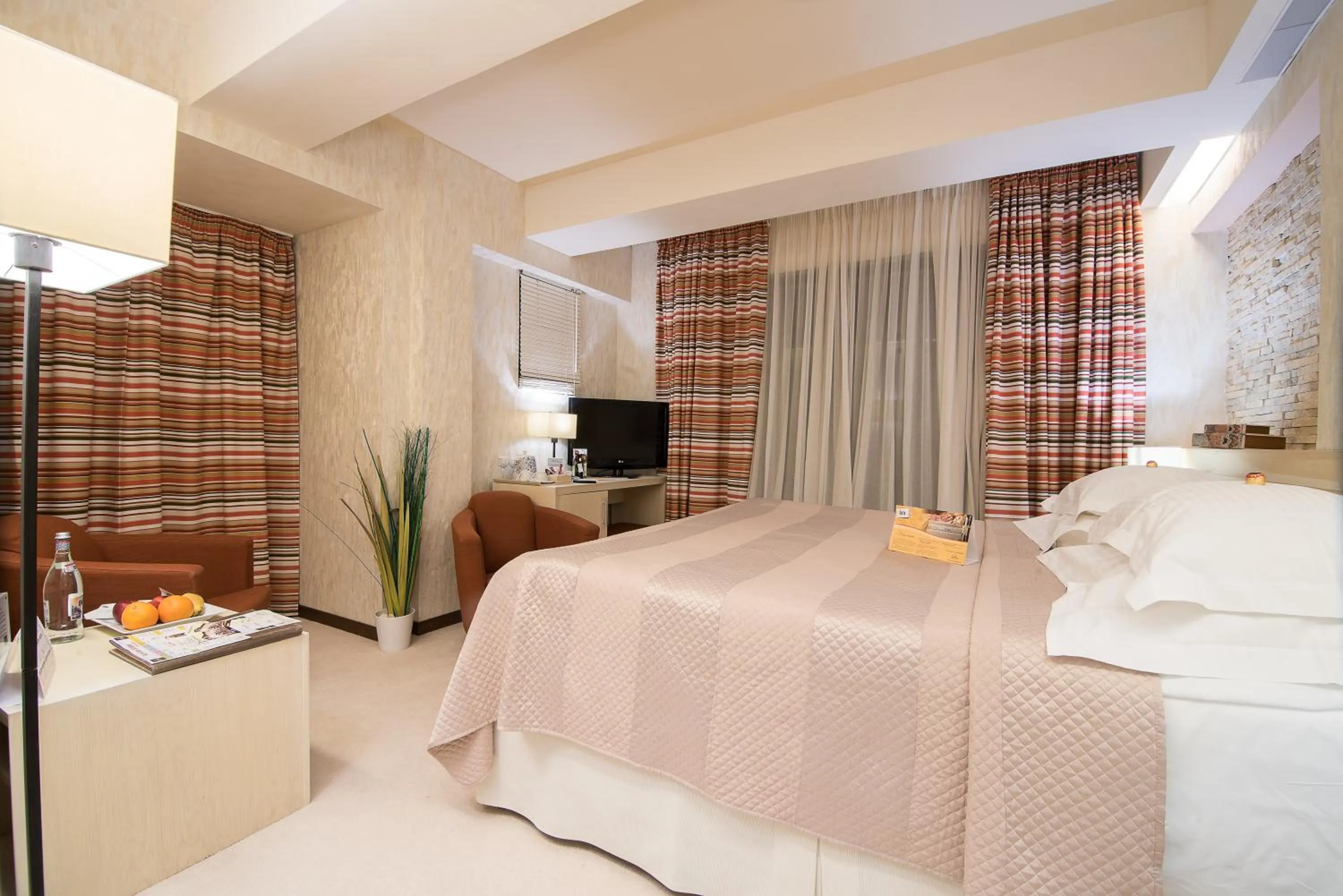Bed in Ioana Boutique Hotel