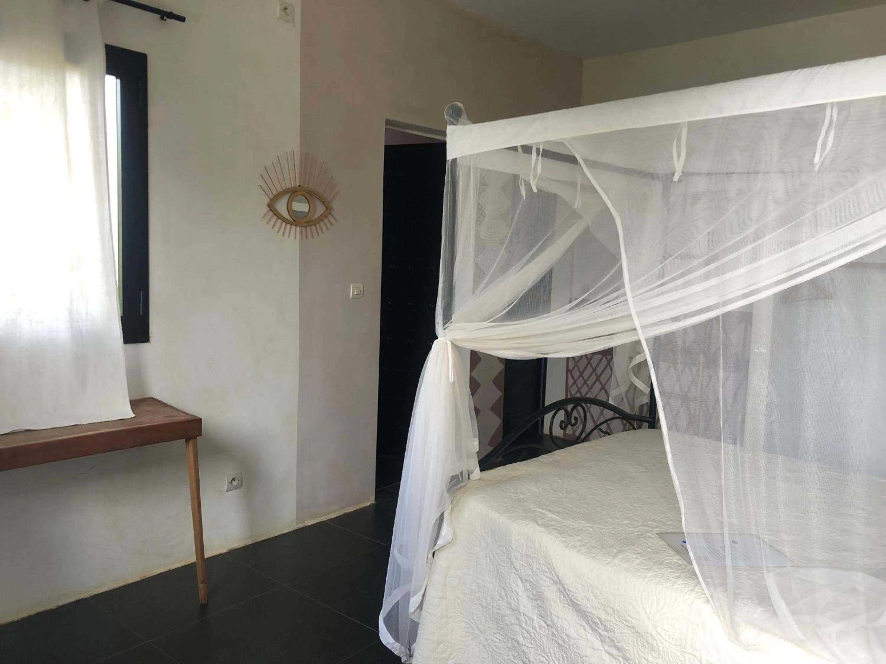 Photo of the whole room, Bed in Bine Bassile