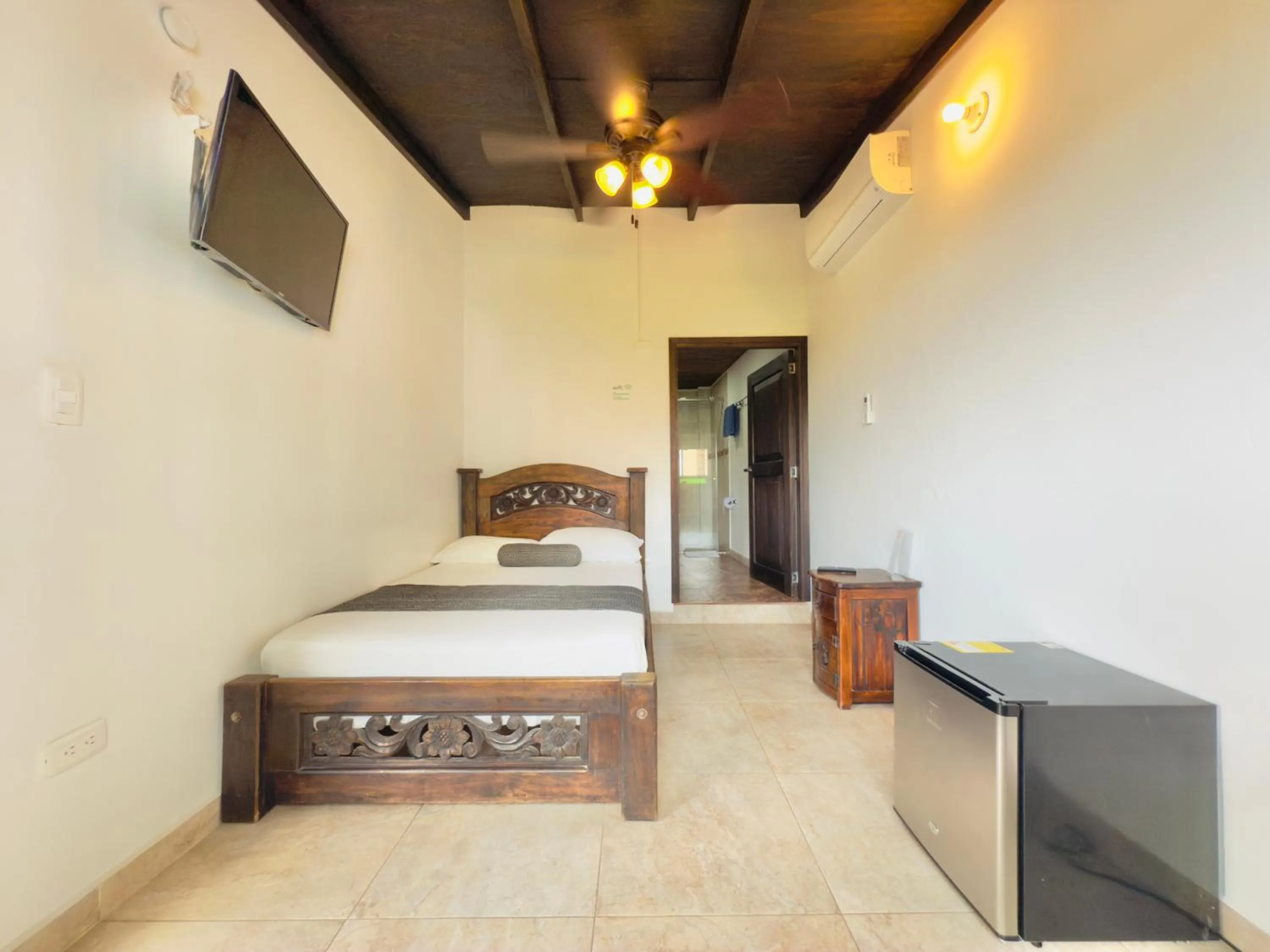 Photo of the whole room, Bed in Santiago DC Hotel