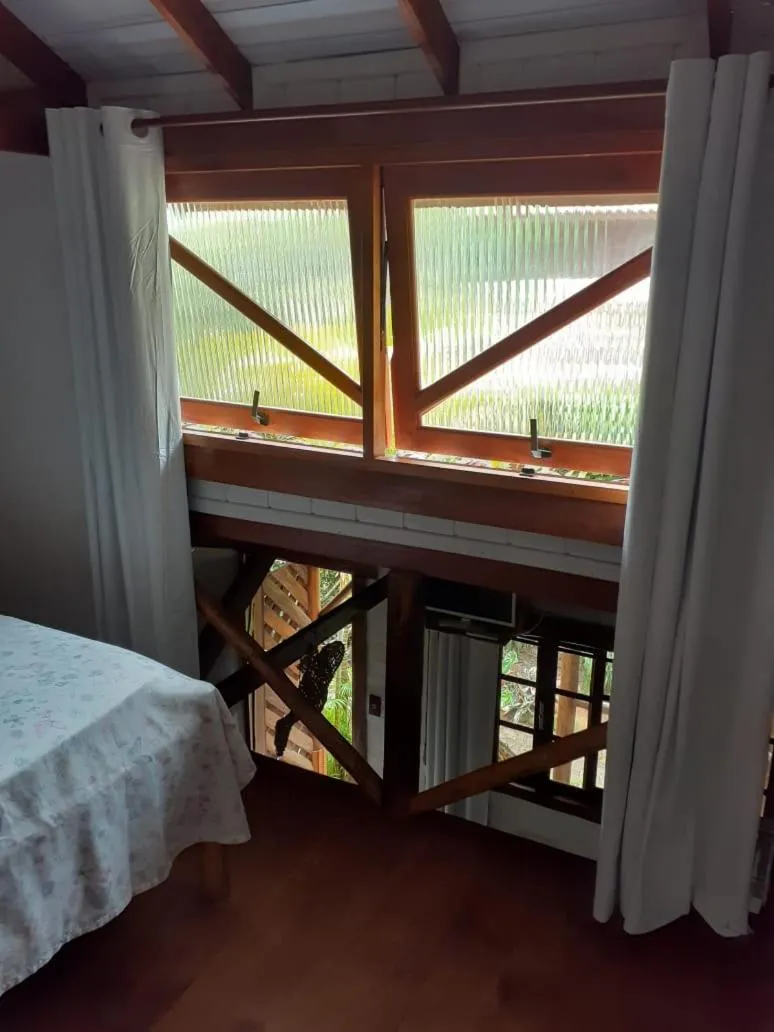 Bed in Recanto das Bromélias Chalés