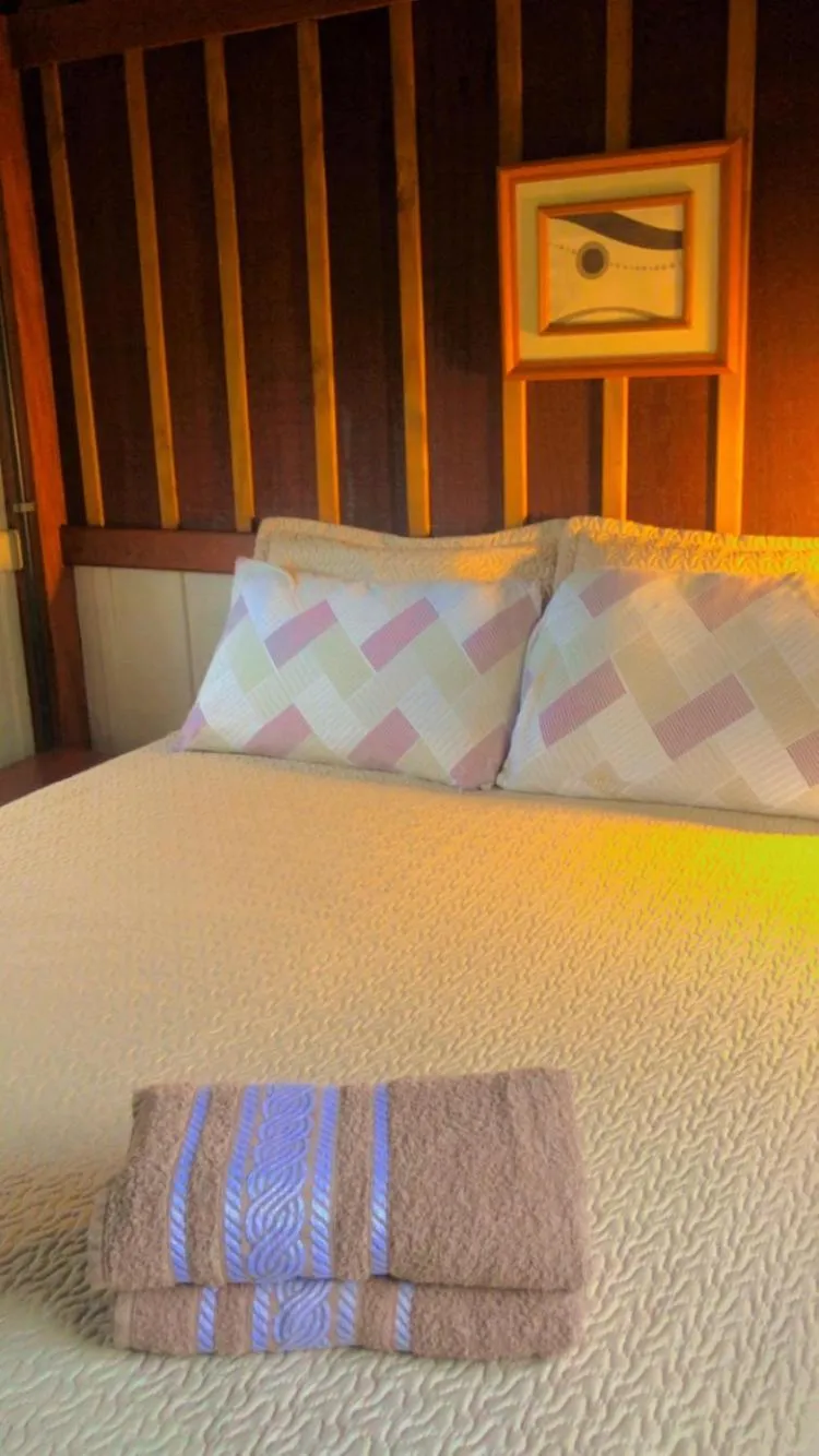 Bed in Recanto das Bromélias Chalés