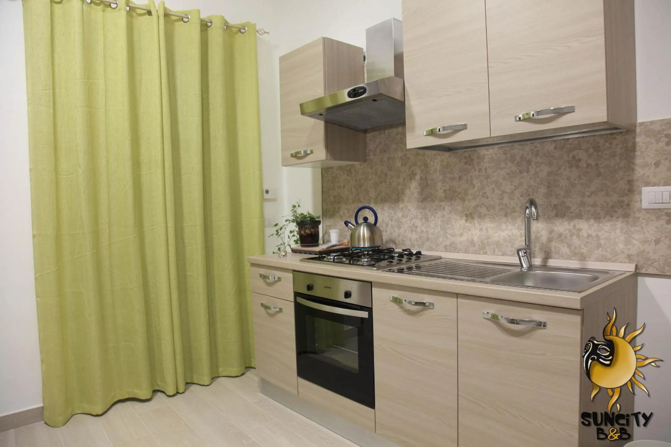 Kitchen or kitchenette in Suncity B&B