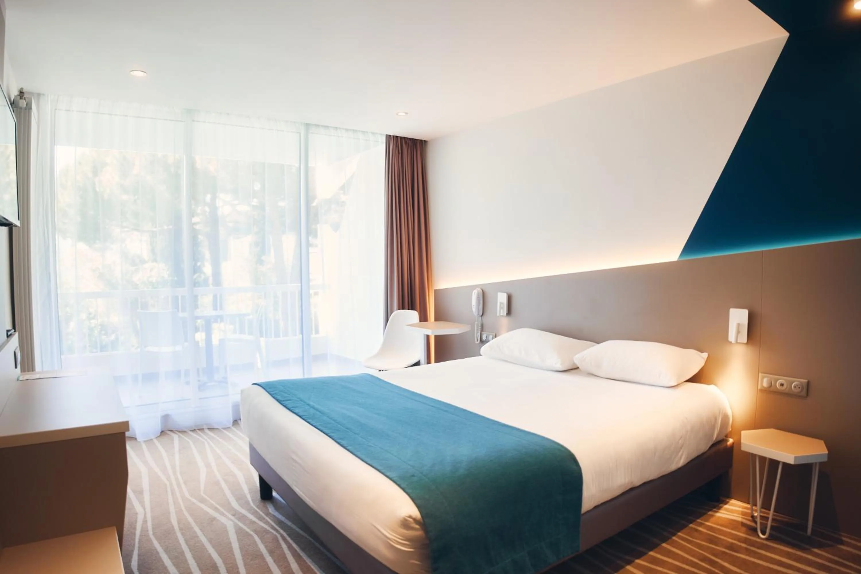 Bed in Hotel Le Quetzal