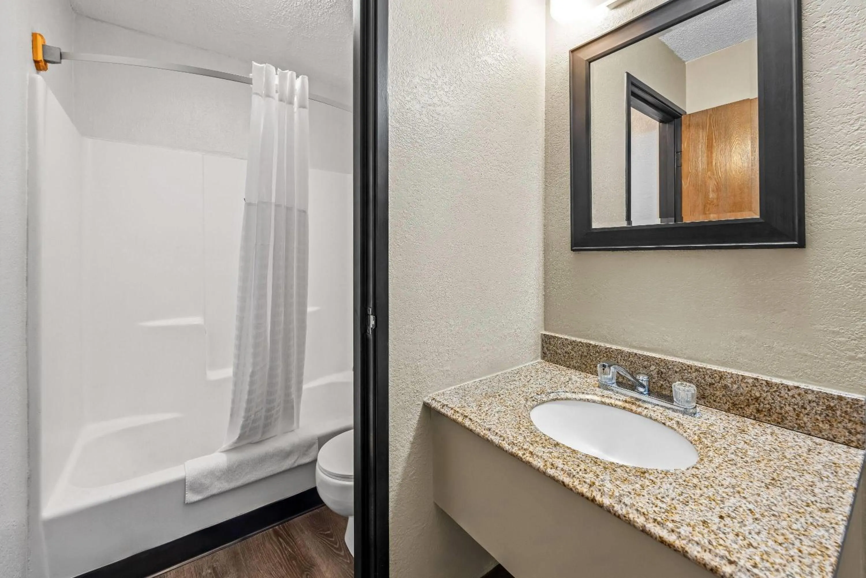 Bathroom in Super 8 by Wyndham Colorado Springs Peterson Space Force