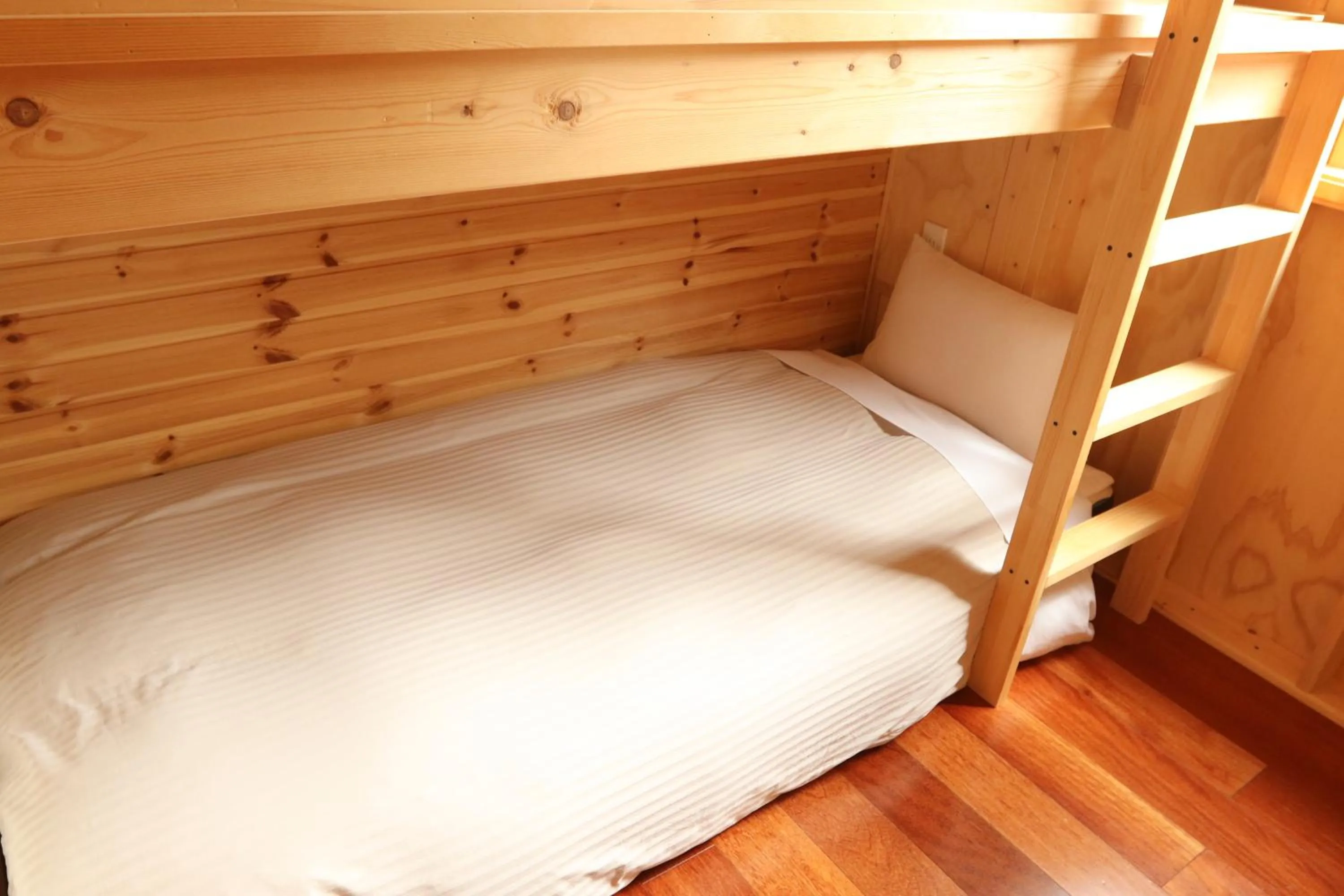 Bed in Phottage inn Biei