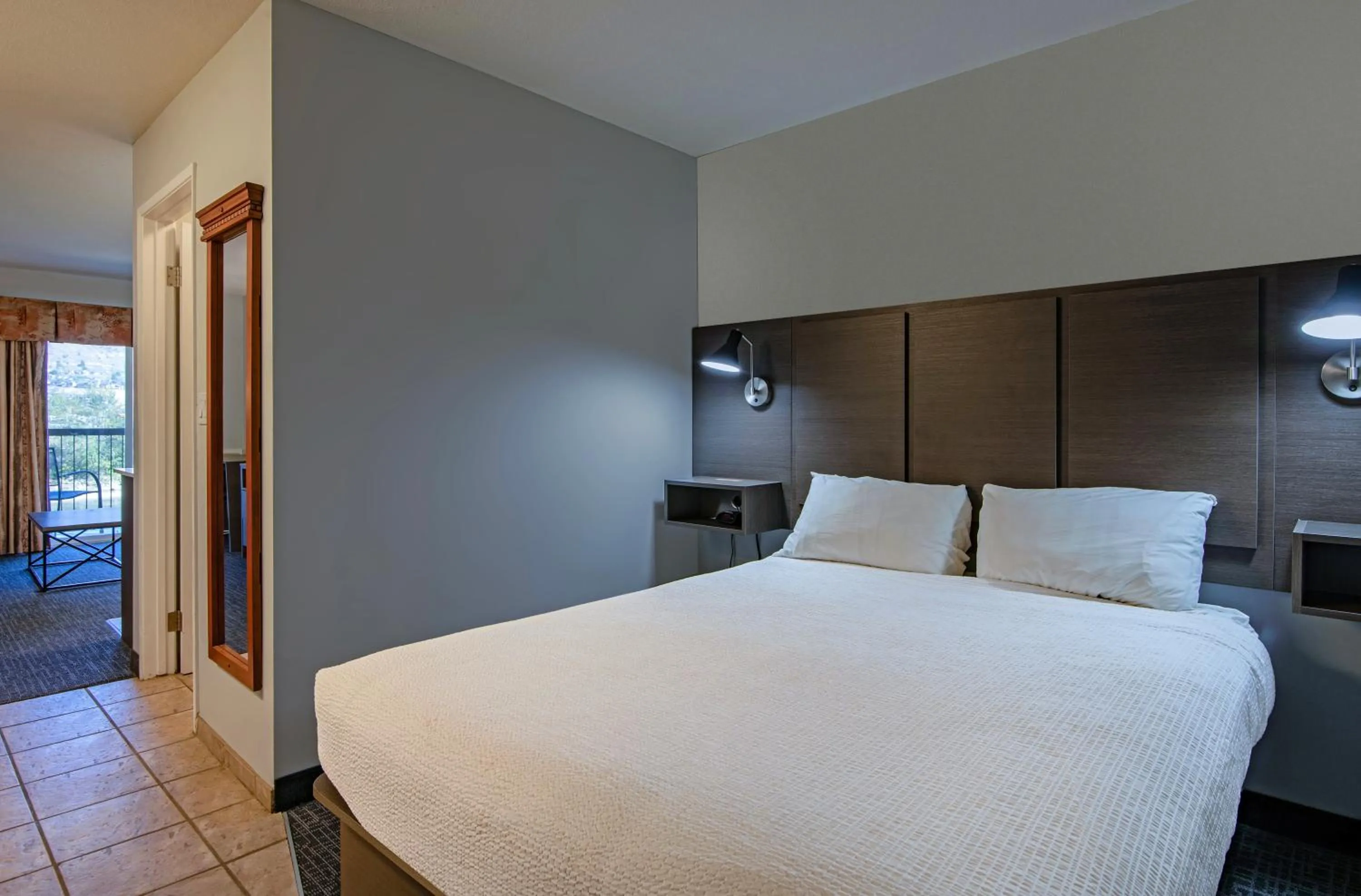 Bed in Riverland Inn & Suites