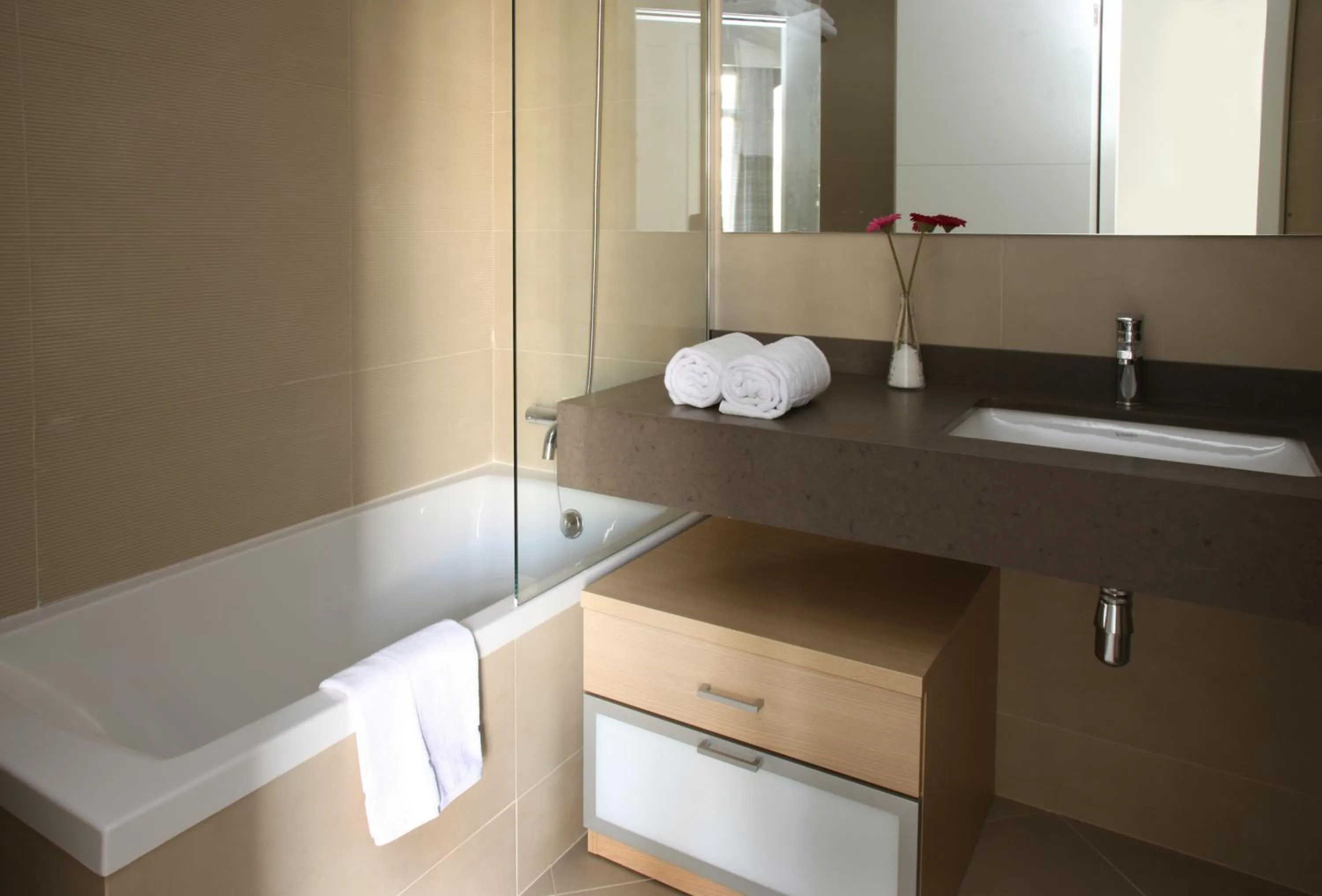 Bathroom in MH Apartments Suites
