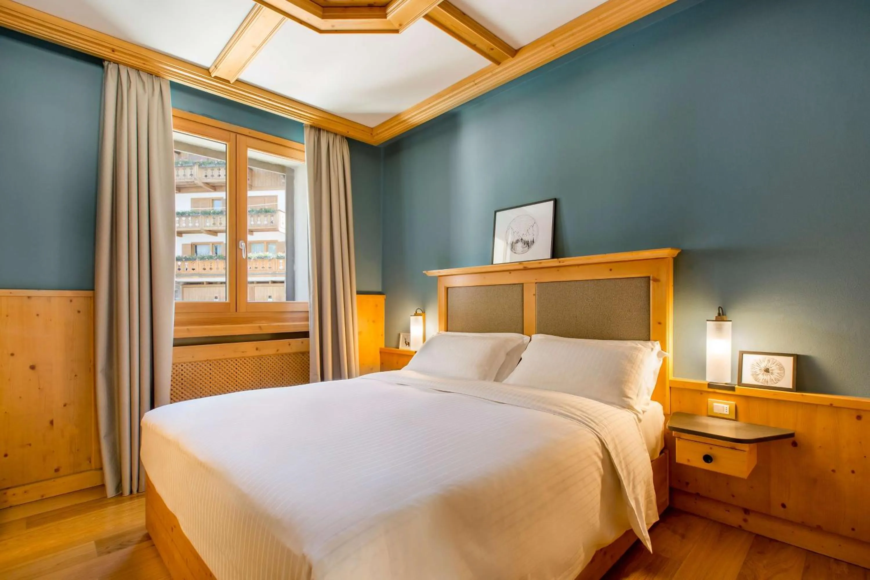 Photo of the whole room, Bed in Radisson Residences Savoia Palace Cortina d’Ampezzo