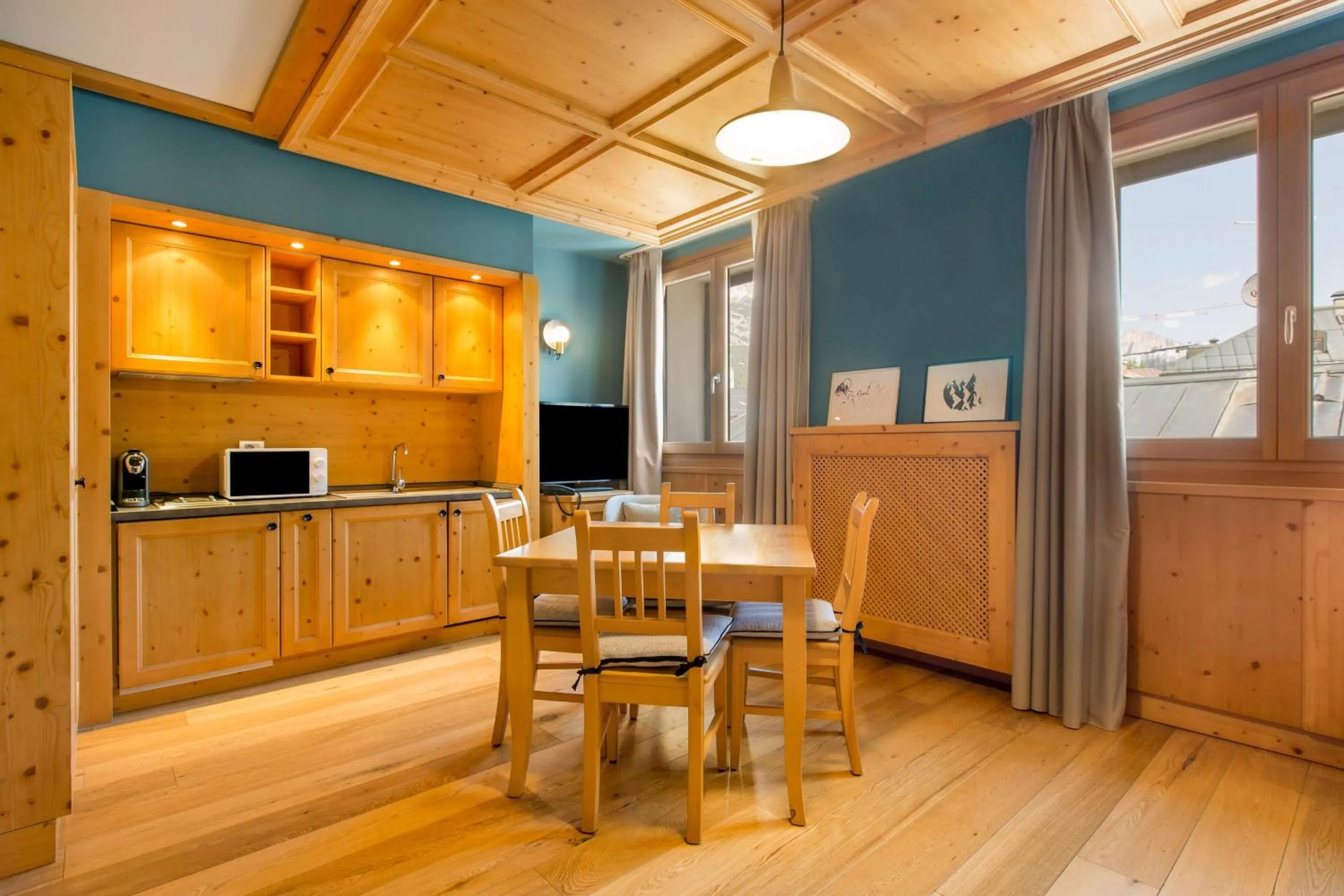 Photo of the whole room in Radisson Residences Savoia Palace Cortina d’Ampezzo