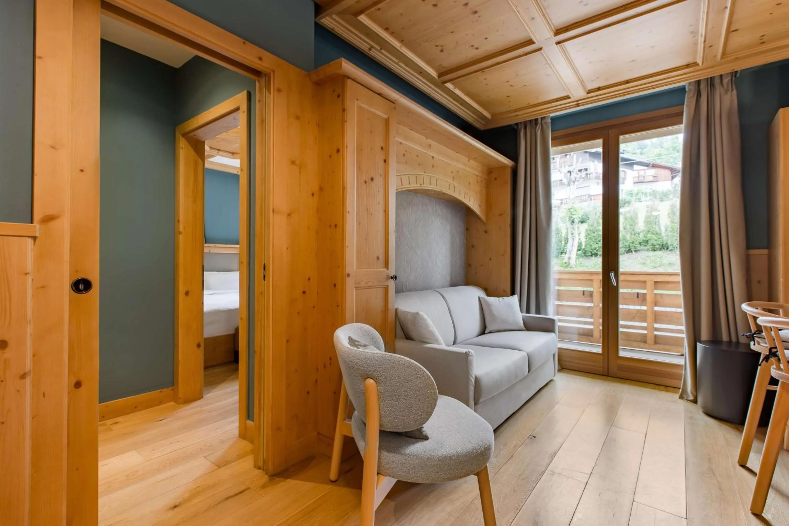 Photo of the whole room in Radisson Residences Savoia Palace Cortina d’Ampezzo