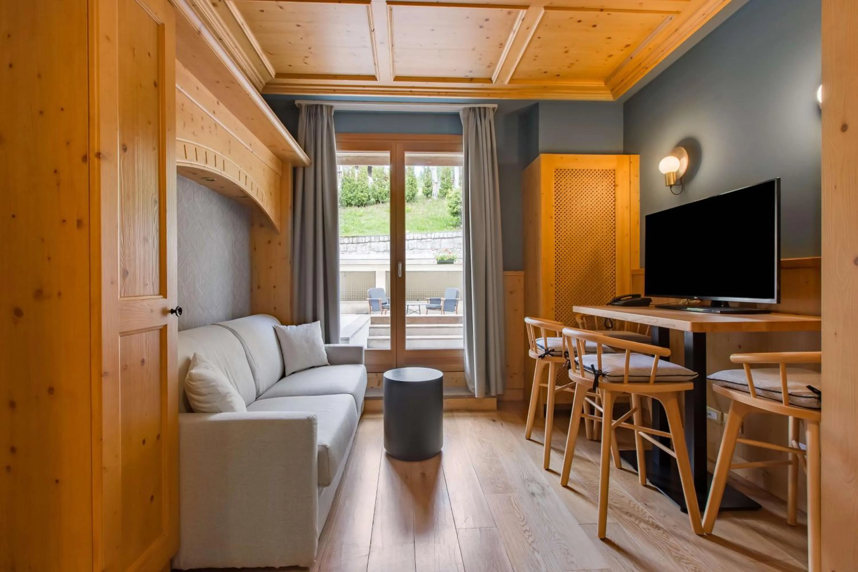 Photo of the whole room in Radisson Residences Savoia Palace Cortina d’Ampezzo