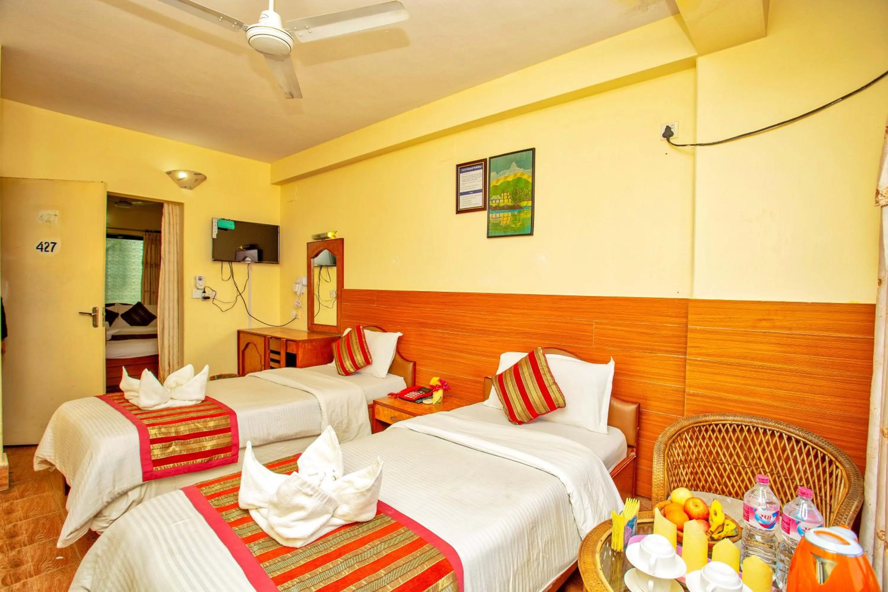 Bed in Hotel Grand Holiday