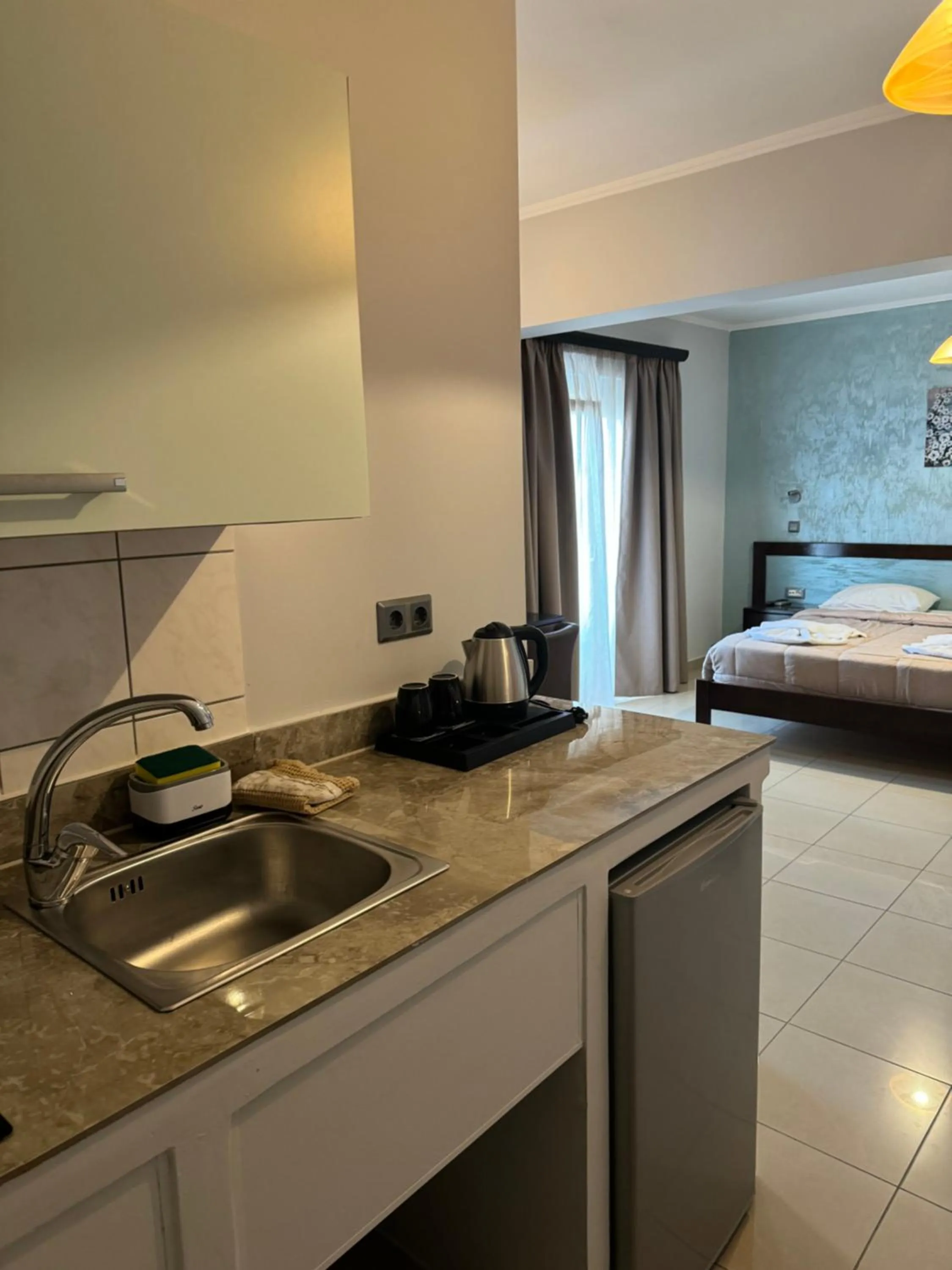 Bed in Comfort Hotel Apartments