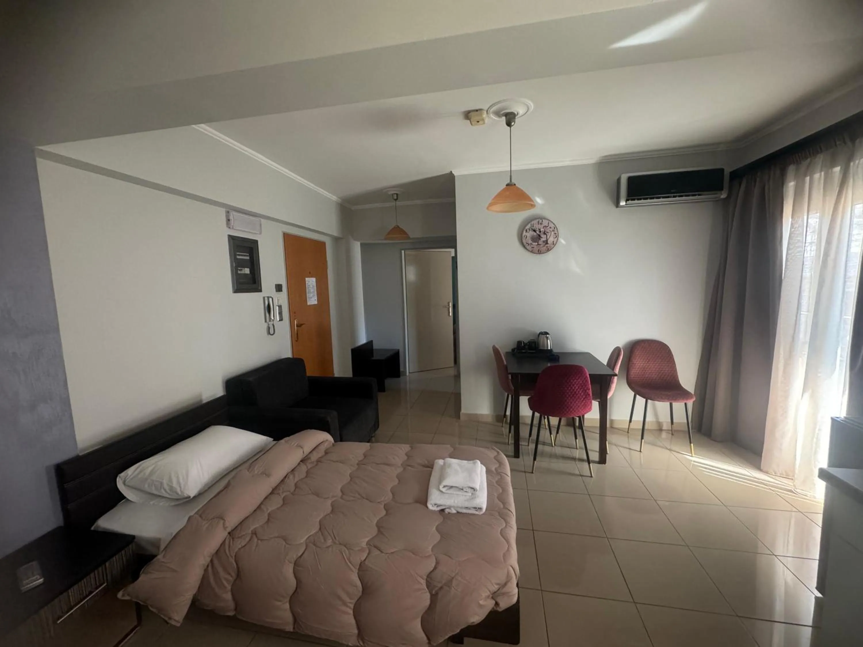 Bed in Comfort Hotel Apartments