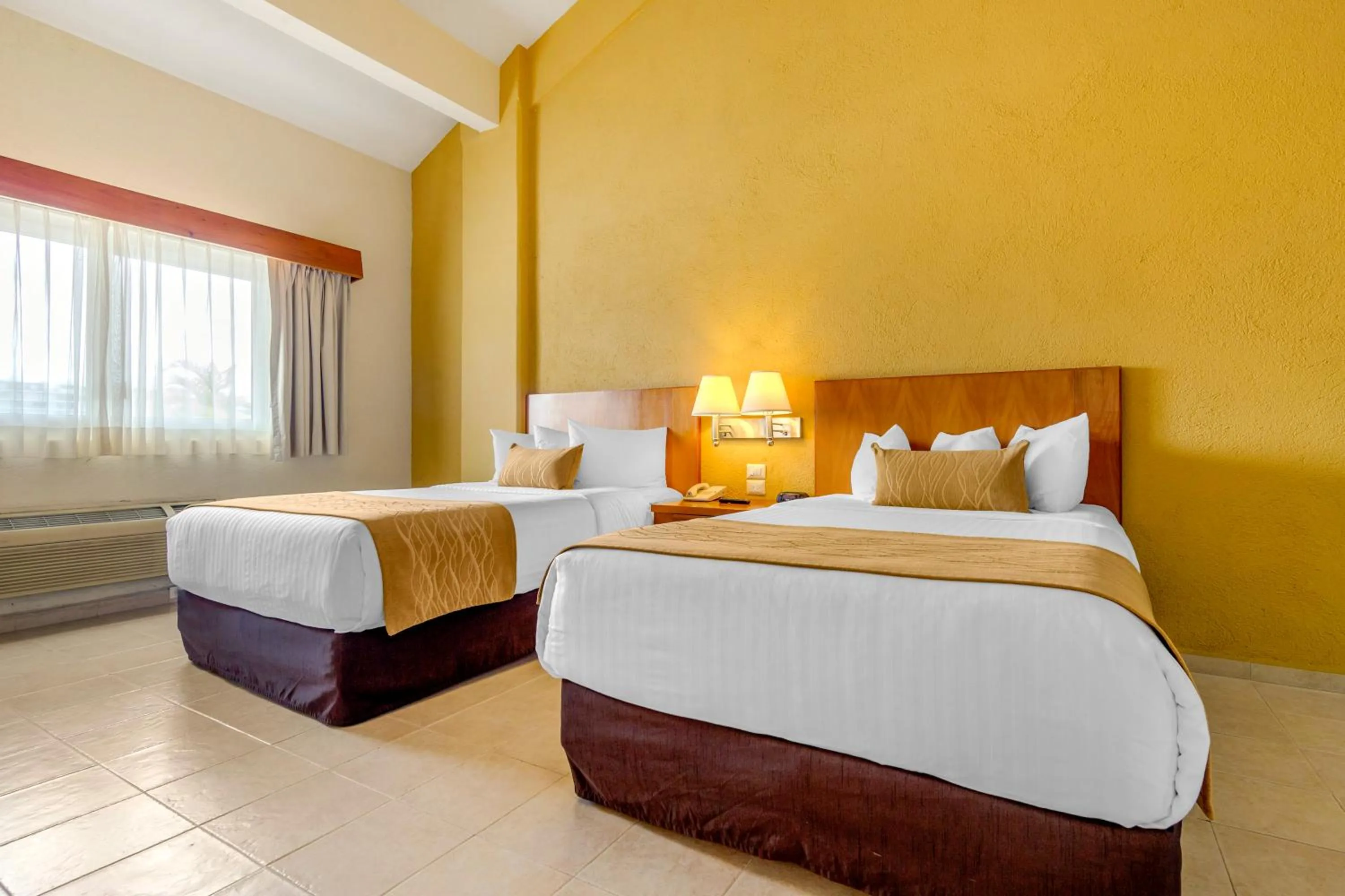 Bedroom, Bed in Comfort Inn Puerto Vallarta Golfside & Marina