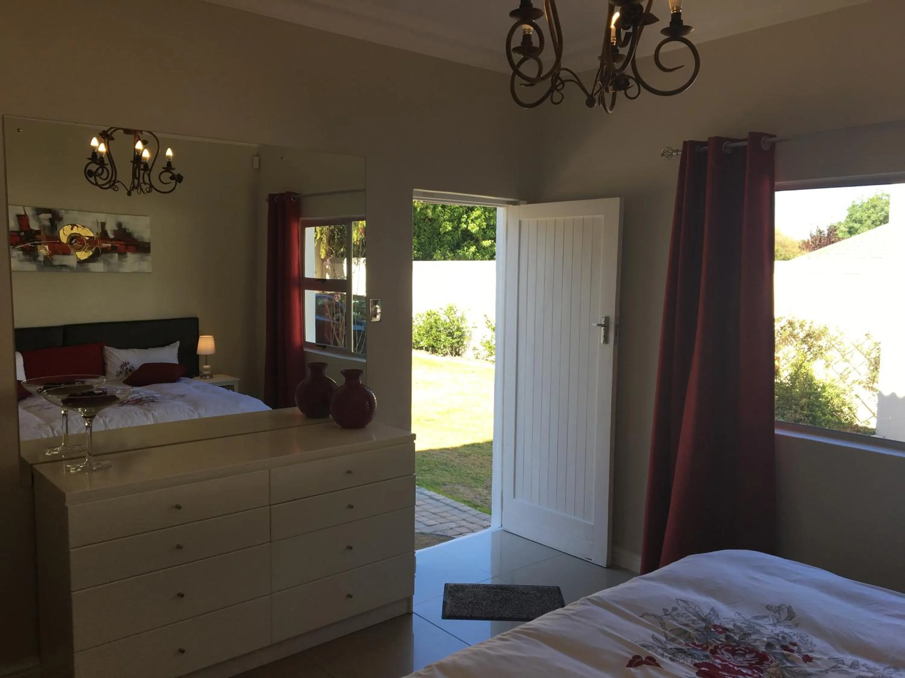 Bedroom in African Palm Cottage and Guesthouse
