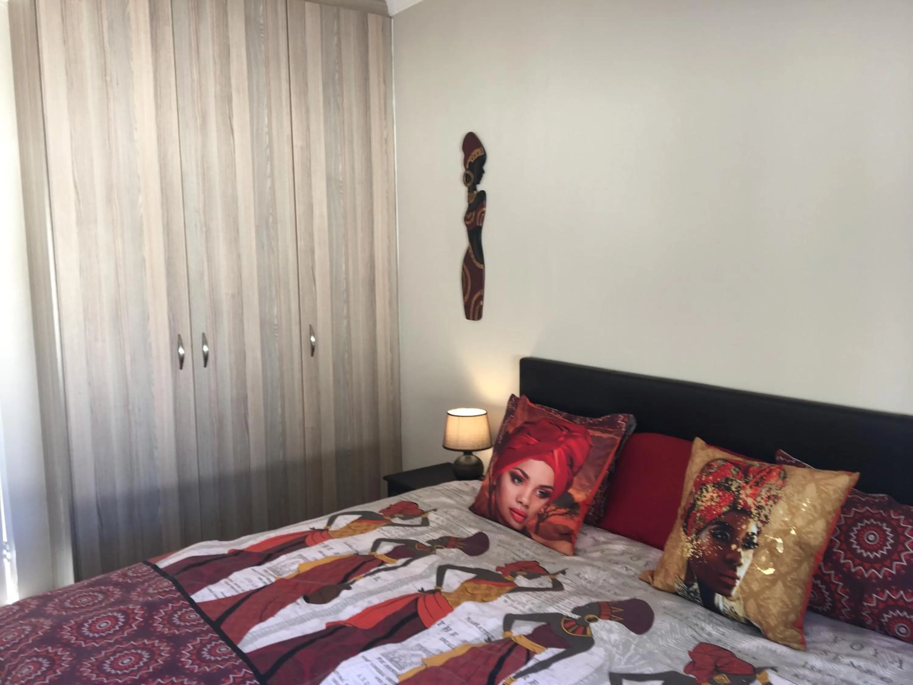 Bedroom in African Palm Cottage and Guesthouse