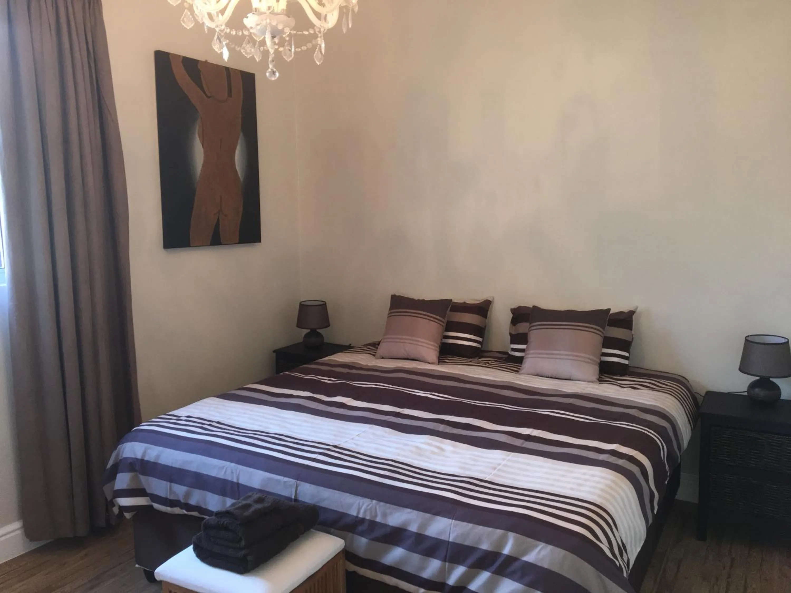 Bedroom in African Palm Cottage and Guesthouse