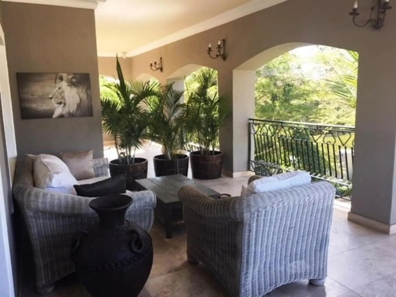 Balcony/Terrace in African Palm Cottage and Guesthouse