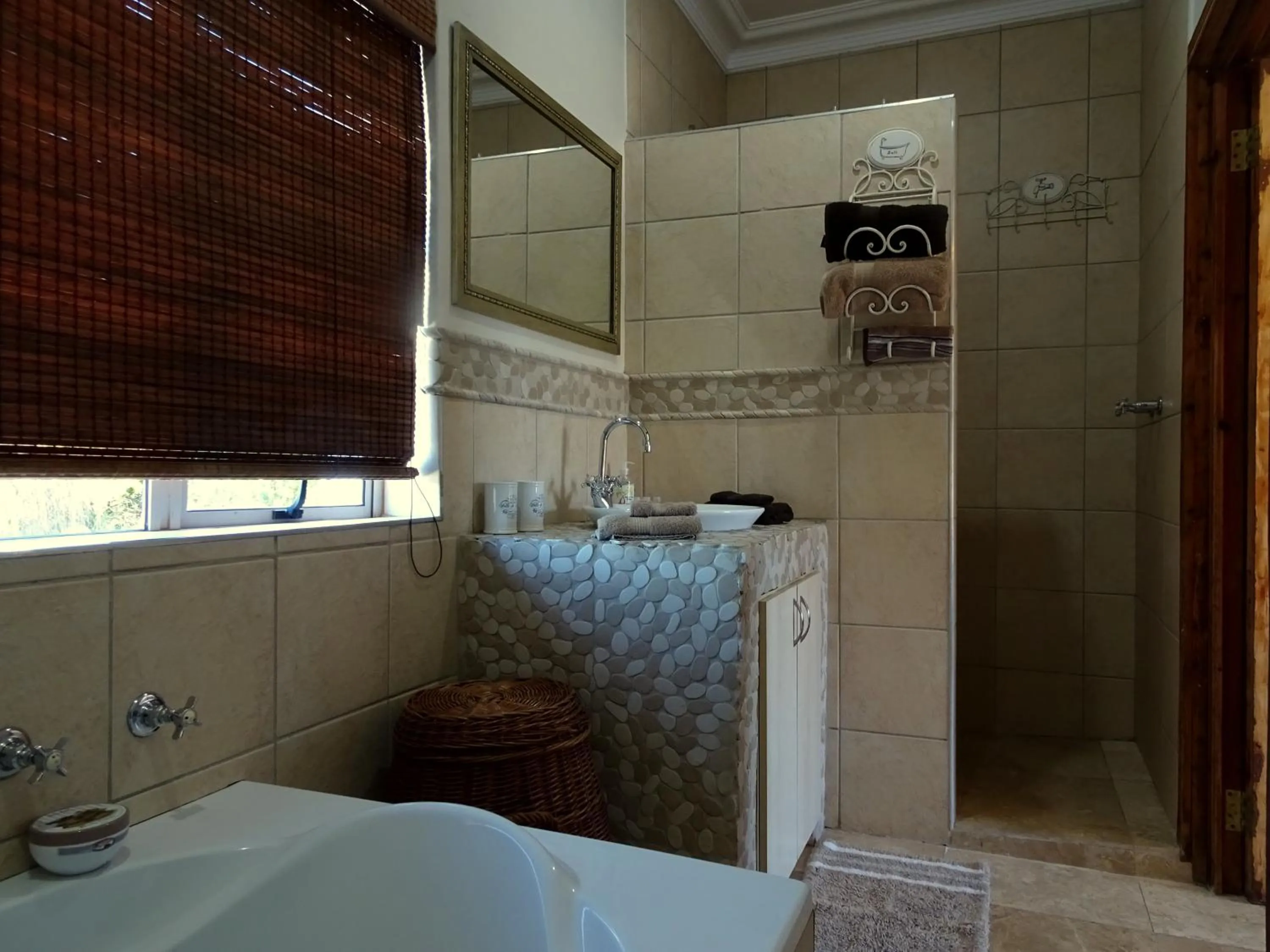 Bathroom in African Palm Cottage and Guesthouse