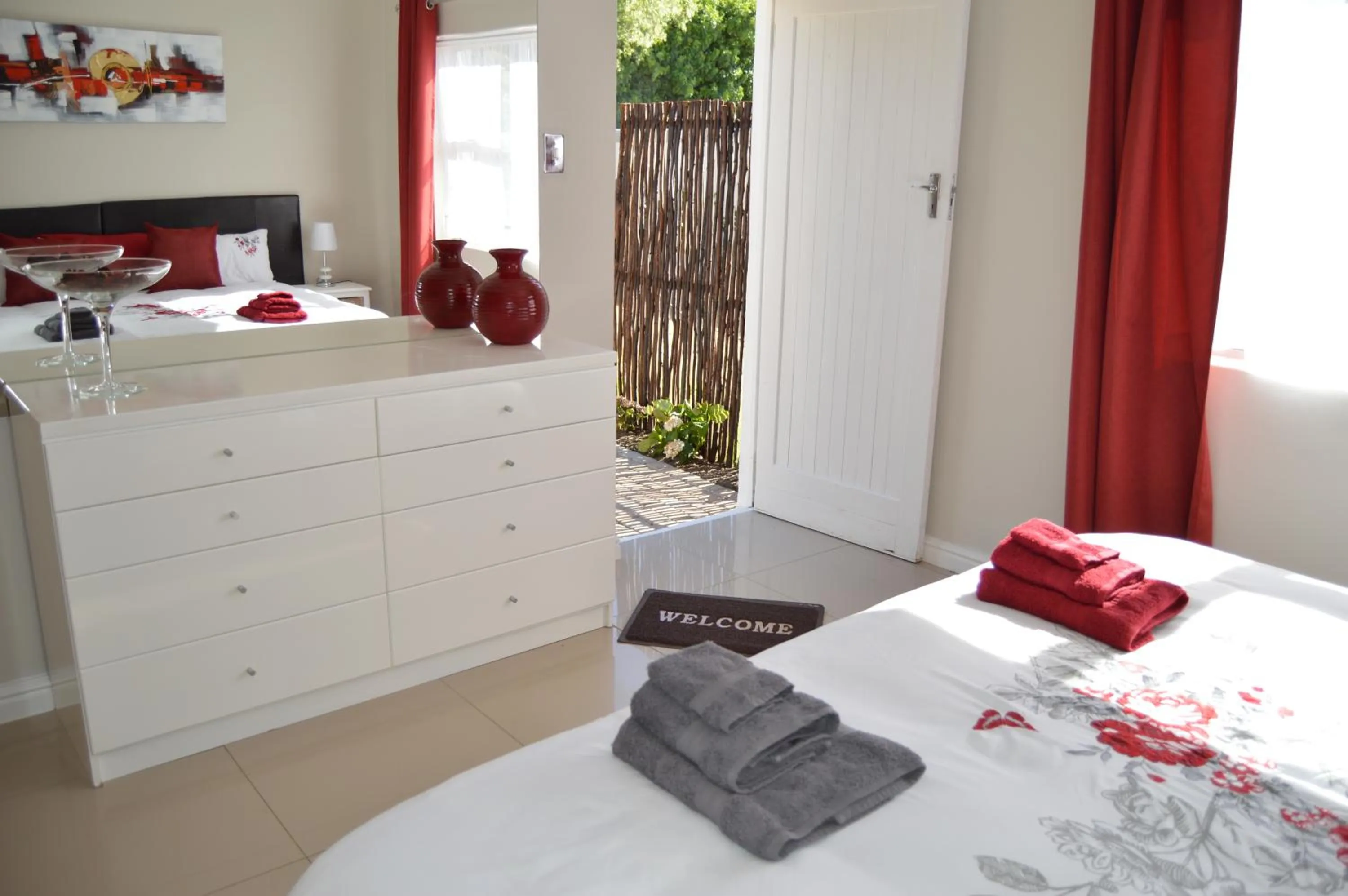 Bedroom in African Palm Cottage and Guesthouse