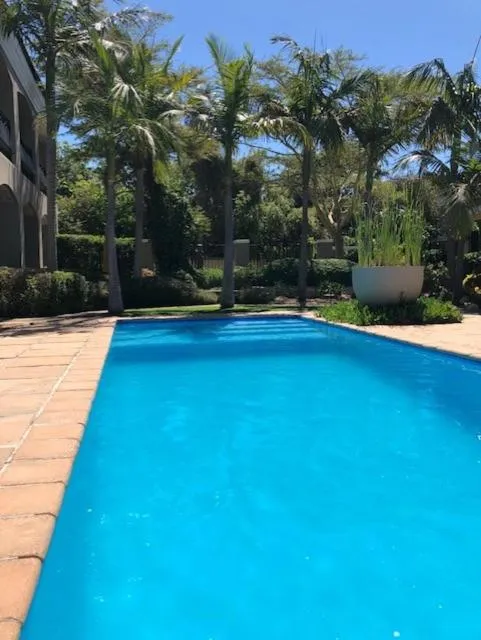 Swimming pool in African Palm Cottage and Guesthouse