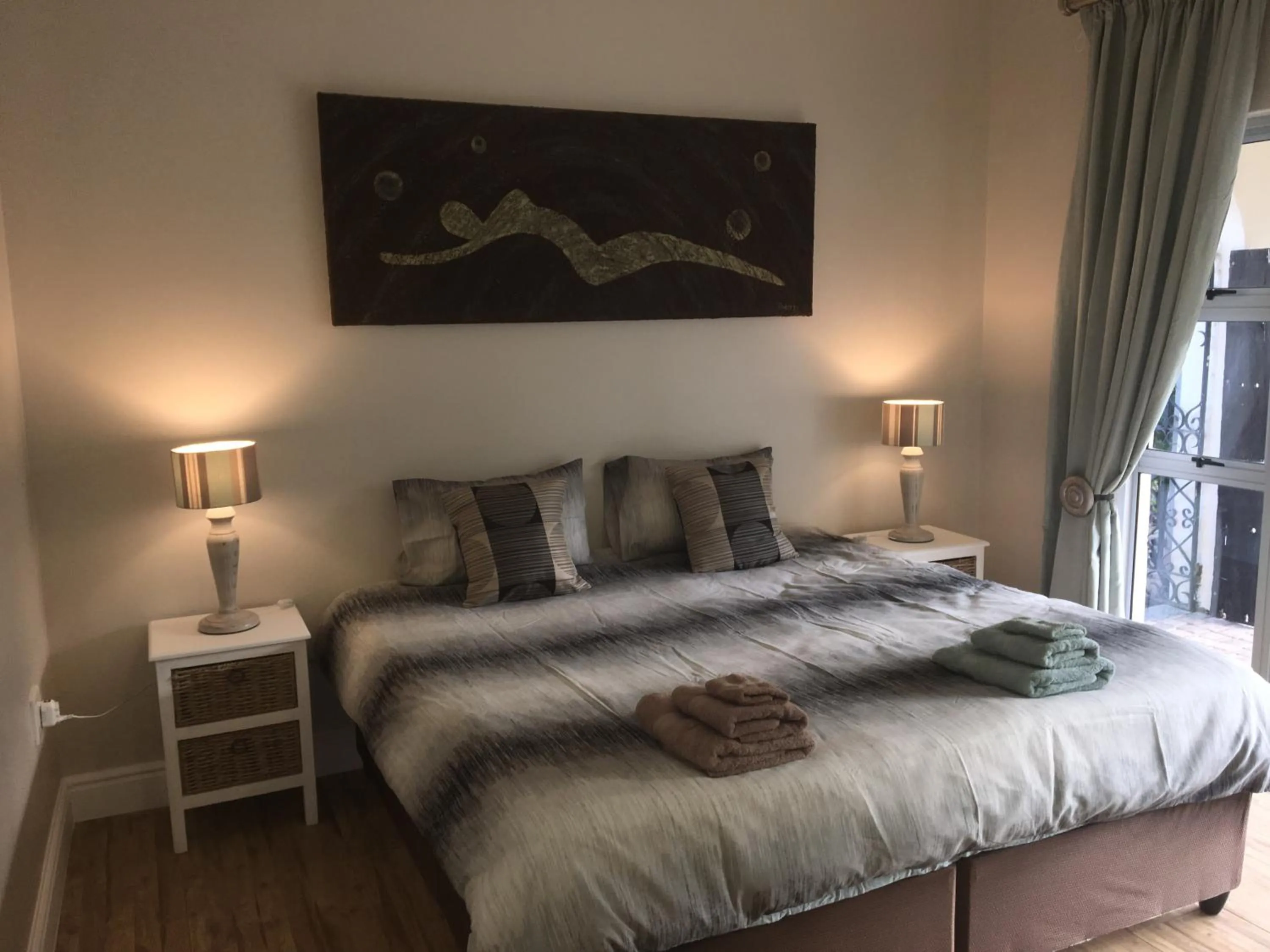 Bedroom in African Palm Cottage and Guesthouse