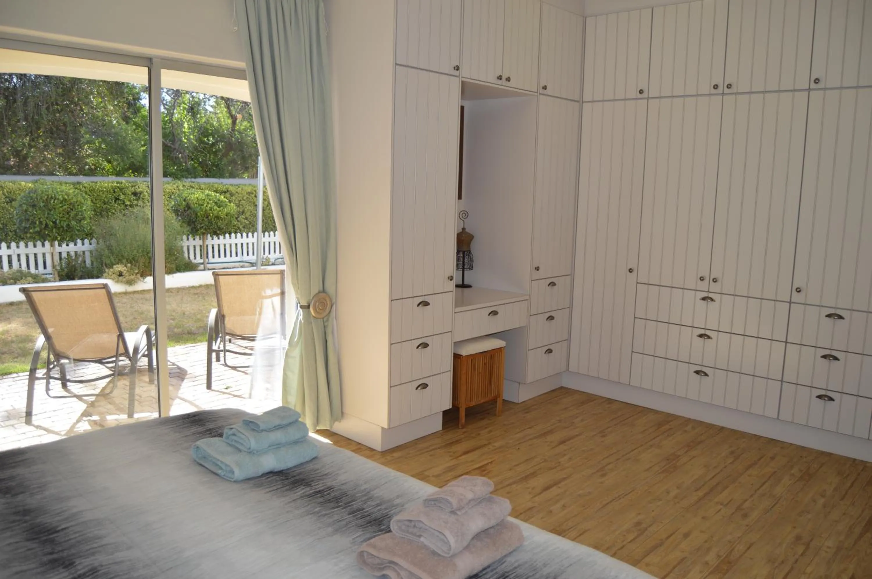 Bedroom in African Palm Cottage and Guesthouse
