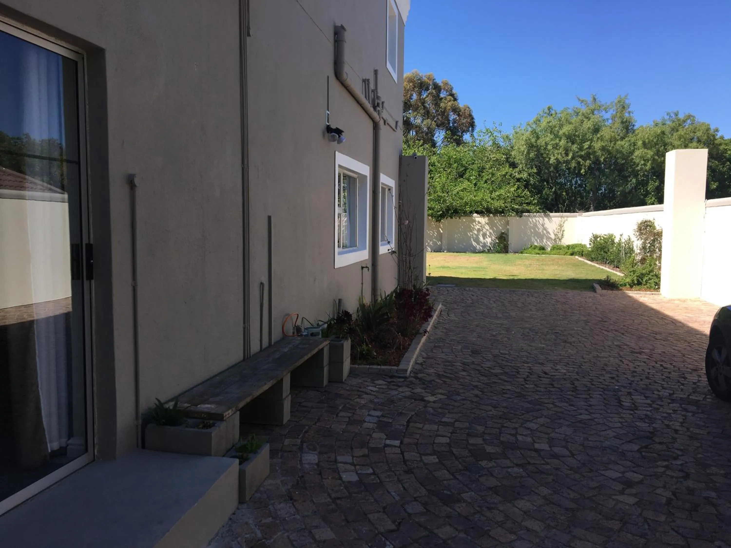 Facade/entrance in African Palm Cottage and Guesthouse