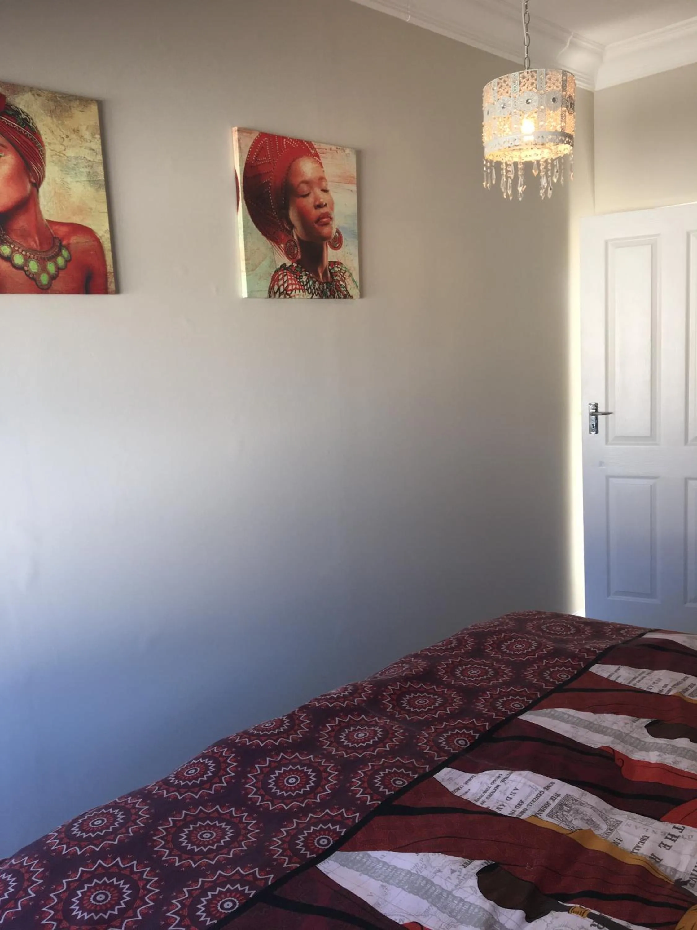 Bedroom in African Palm Cottage and Guesthouse
