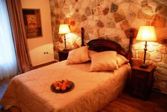 Bed in Korina Gallery Hotel