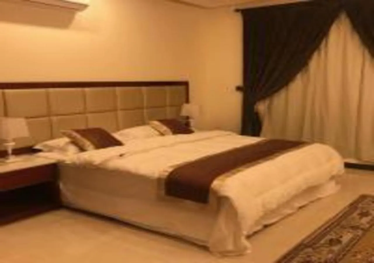 Bed in Ashbilia Suites
