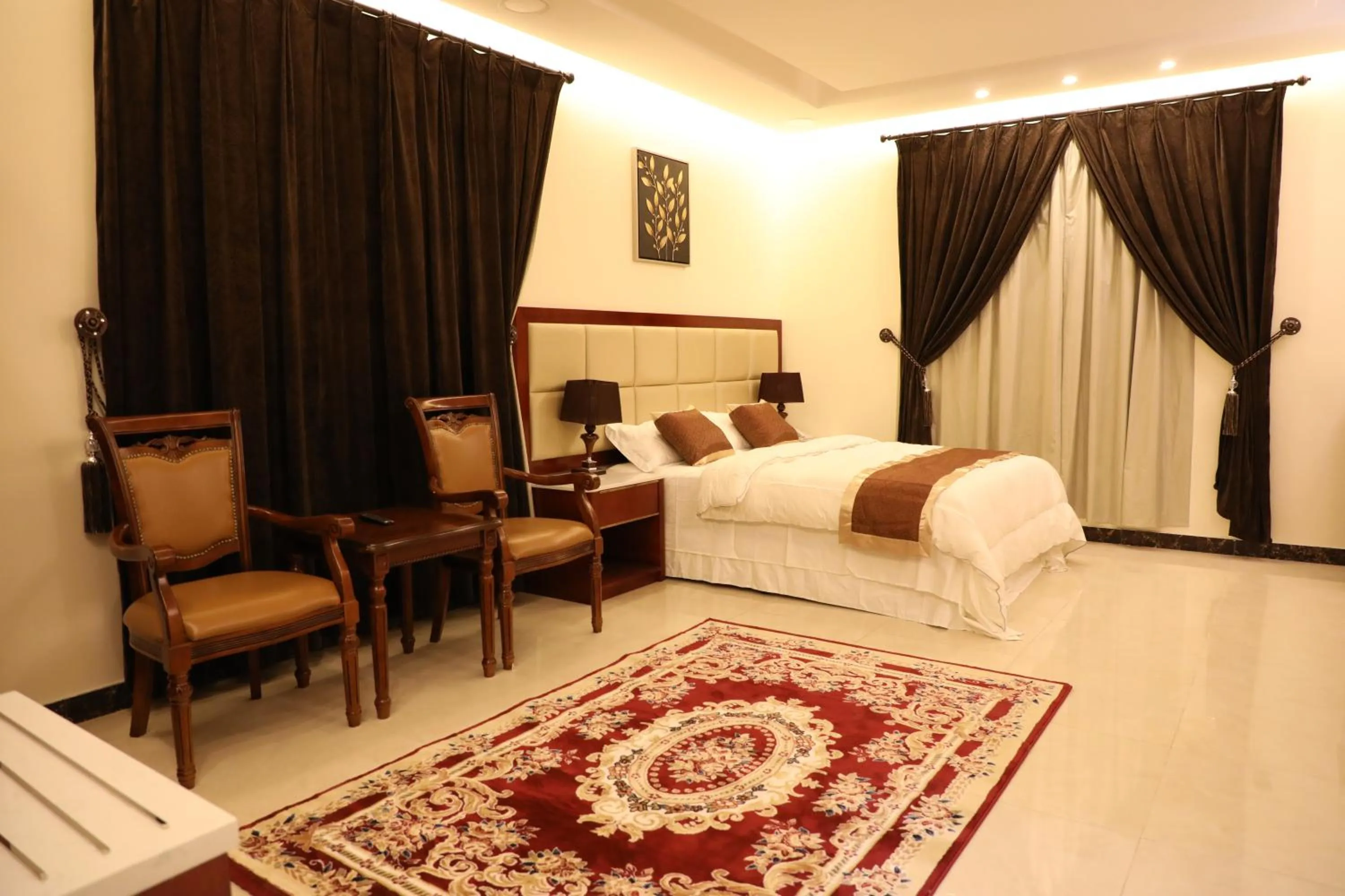 Bed in Ashbilia Suites