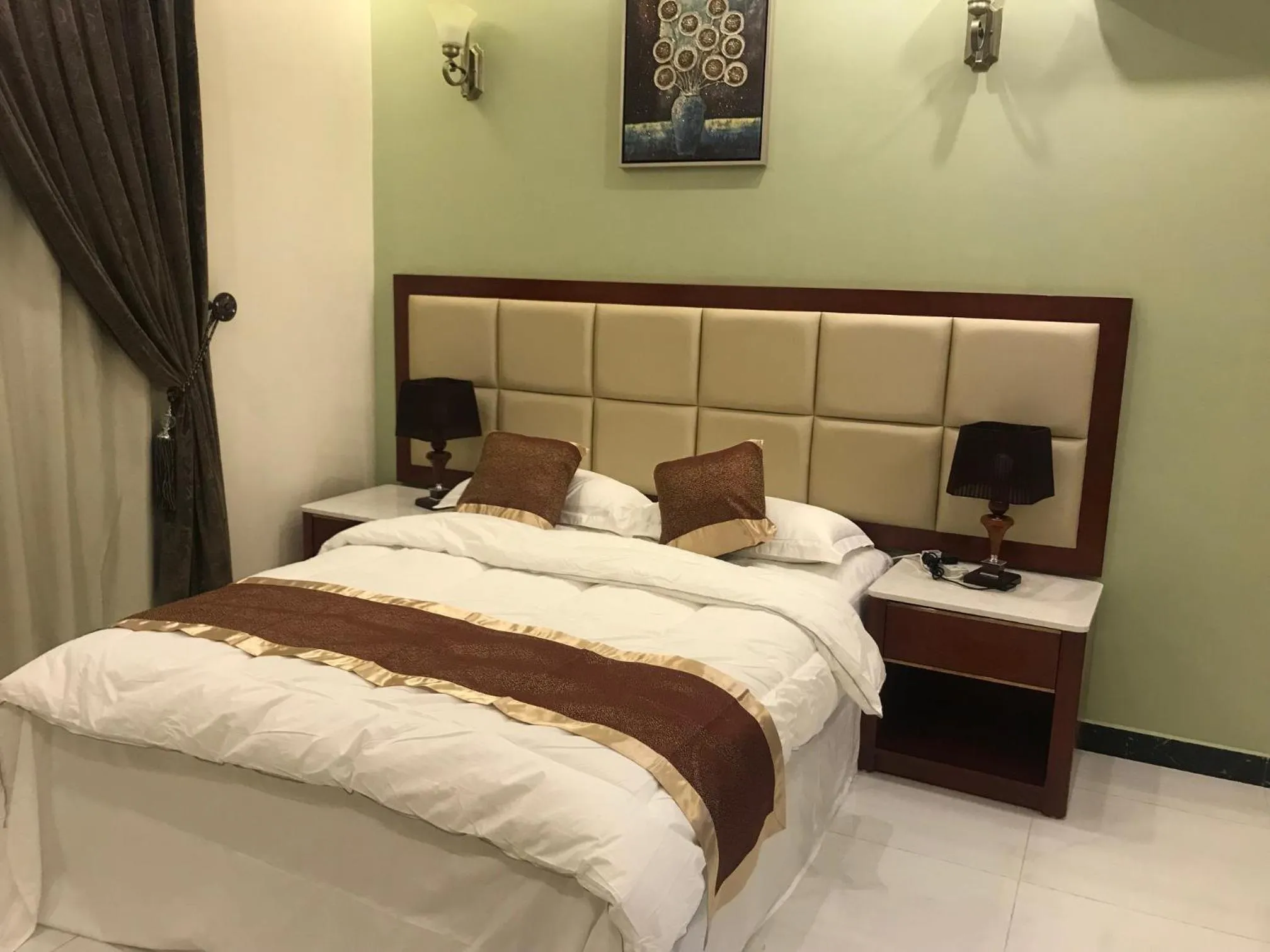 Bed in Ashbilia Suites