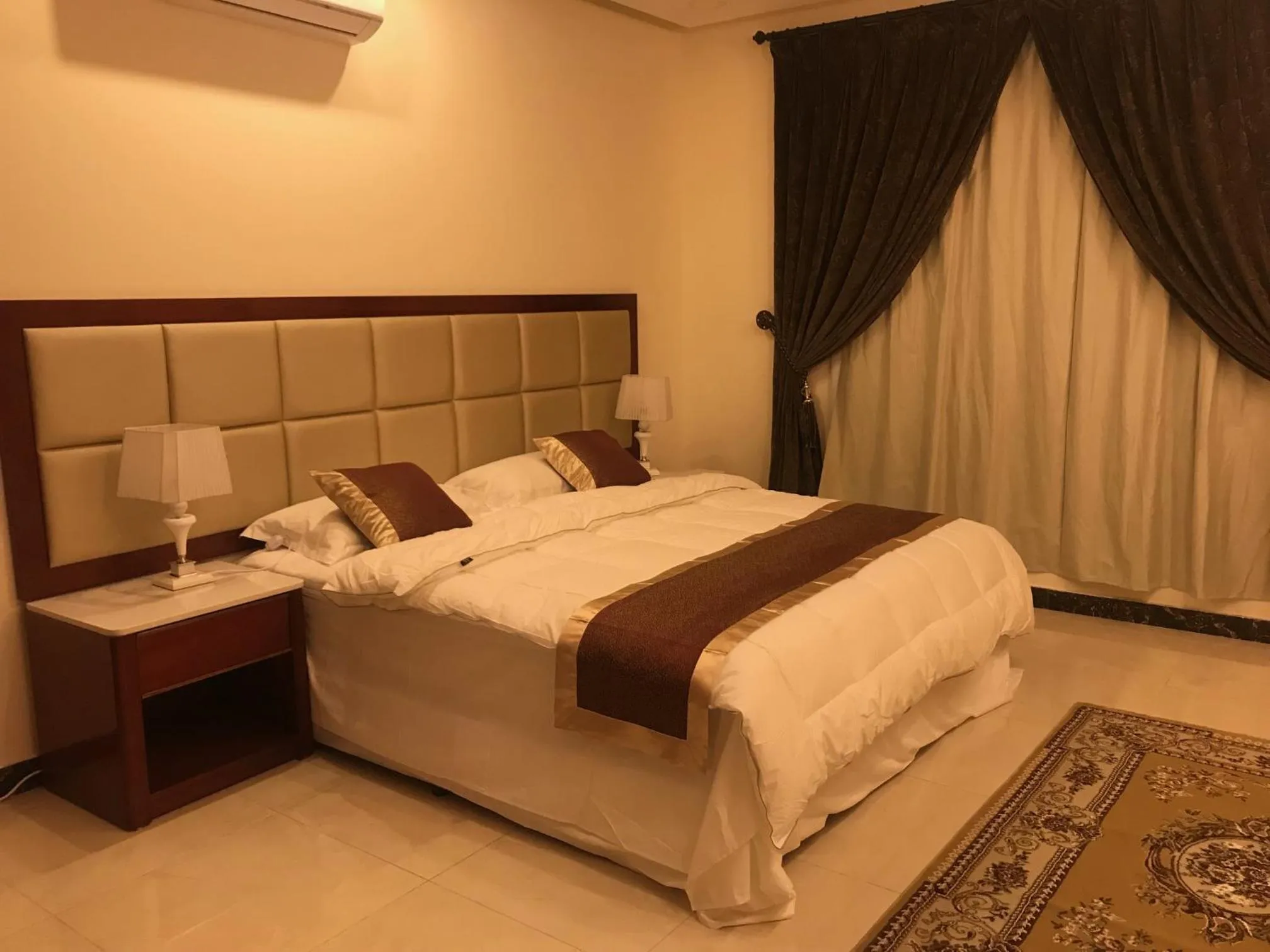 Bed in Ashbilia Suites