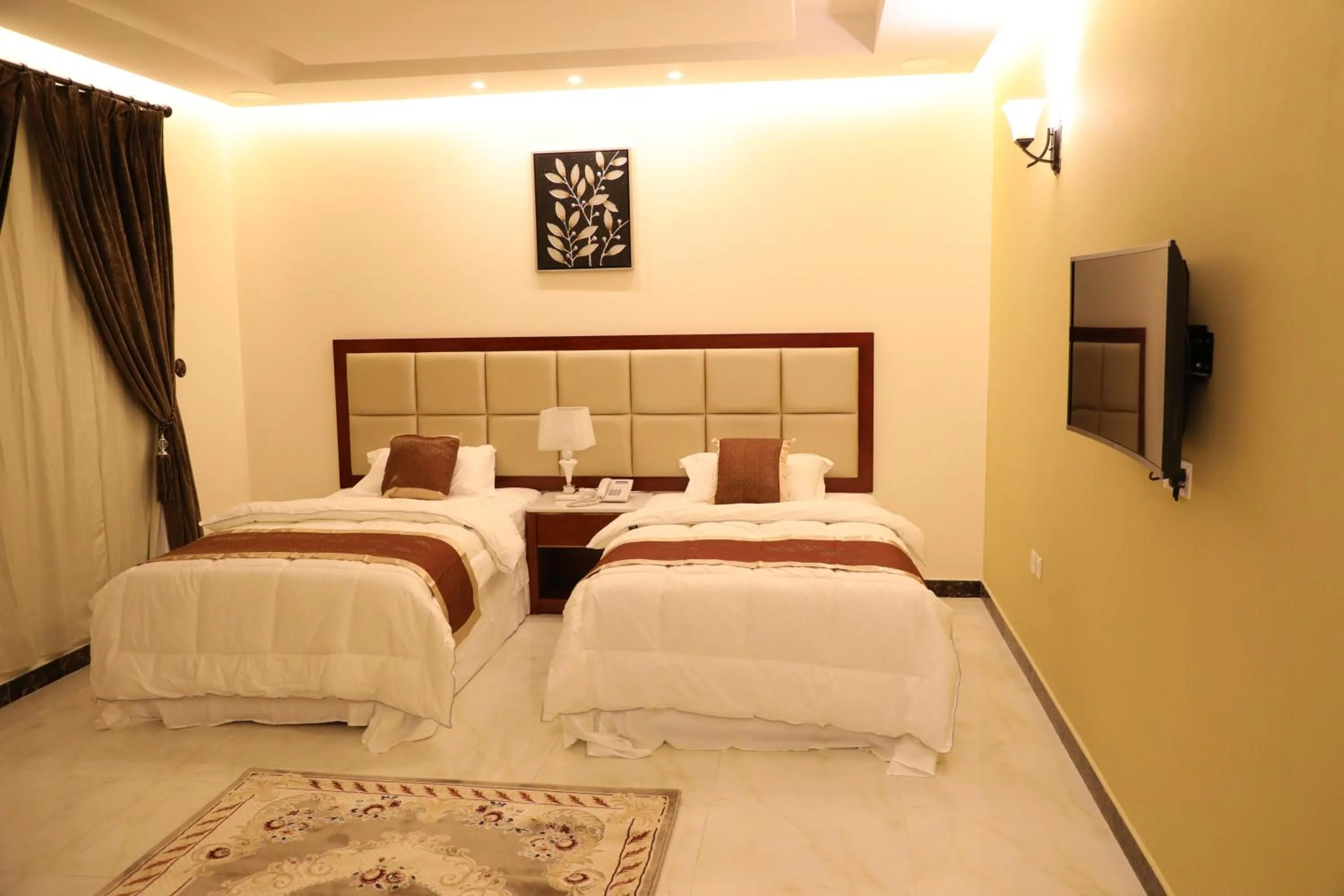 Bed in Ashbilia Suites