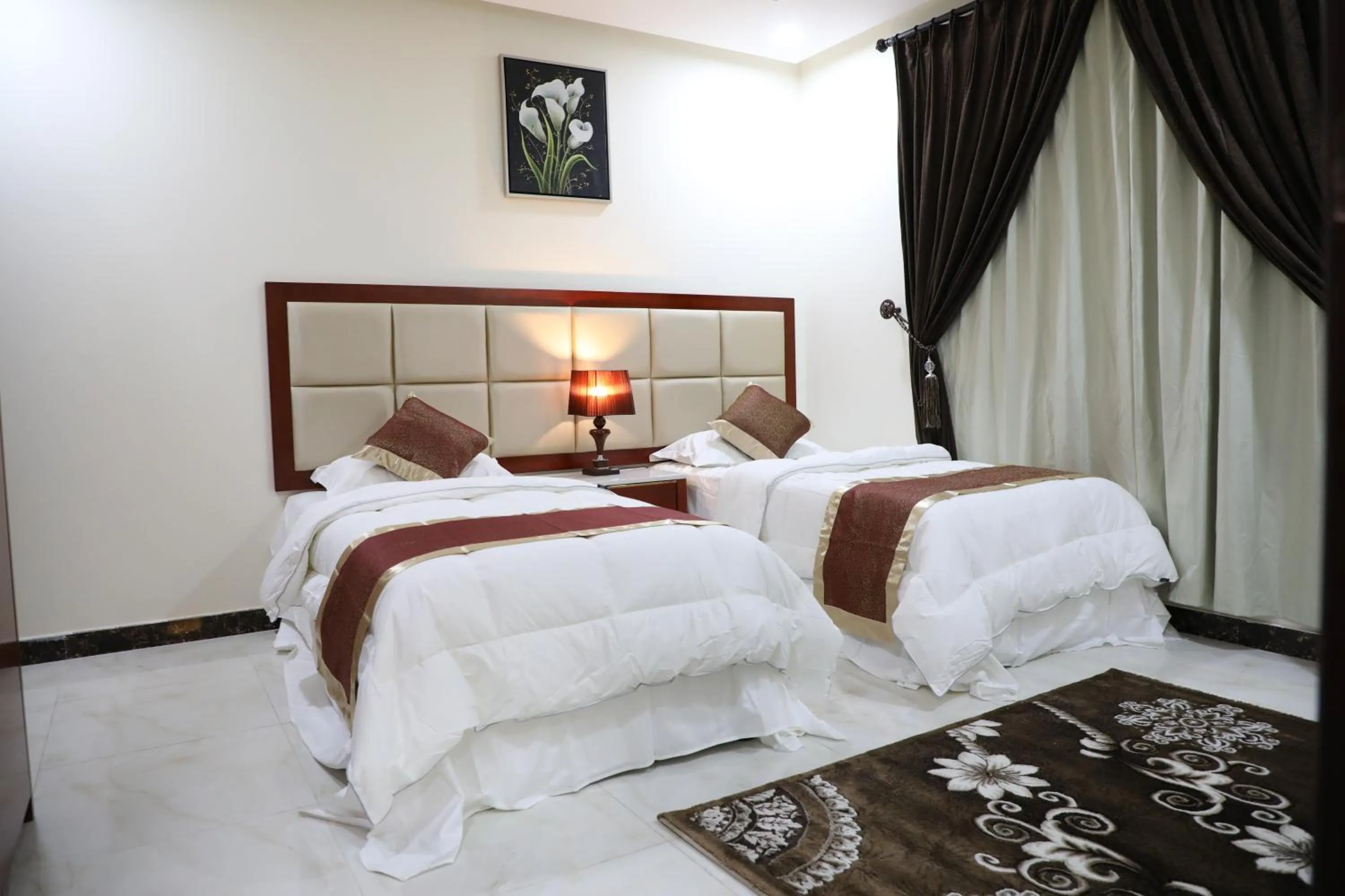 Bed in Ashbilia Suites
