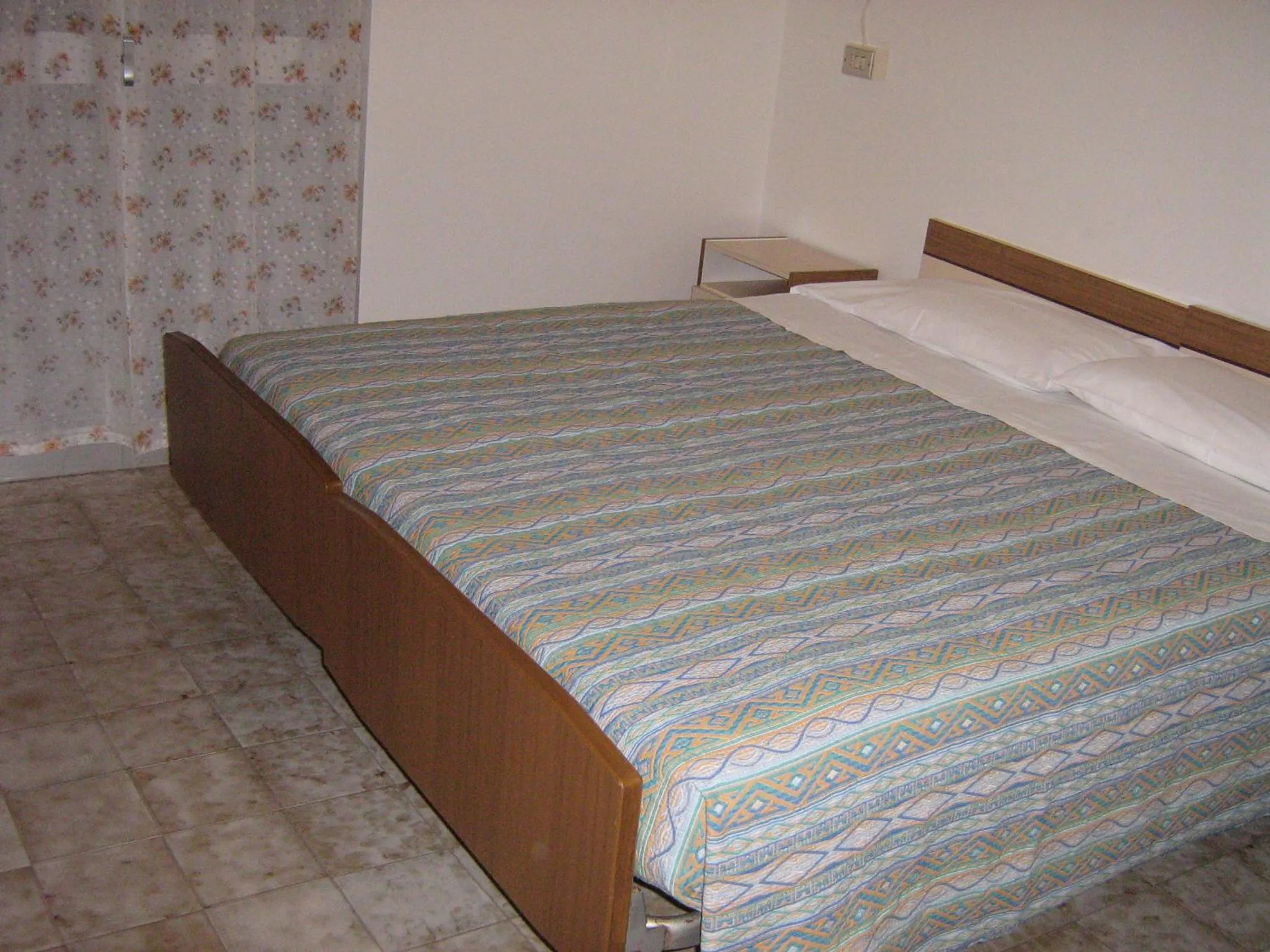 Bed in Hotel Toschi